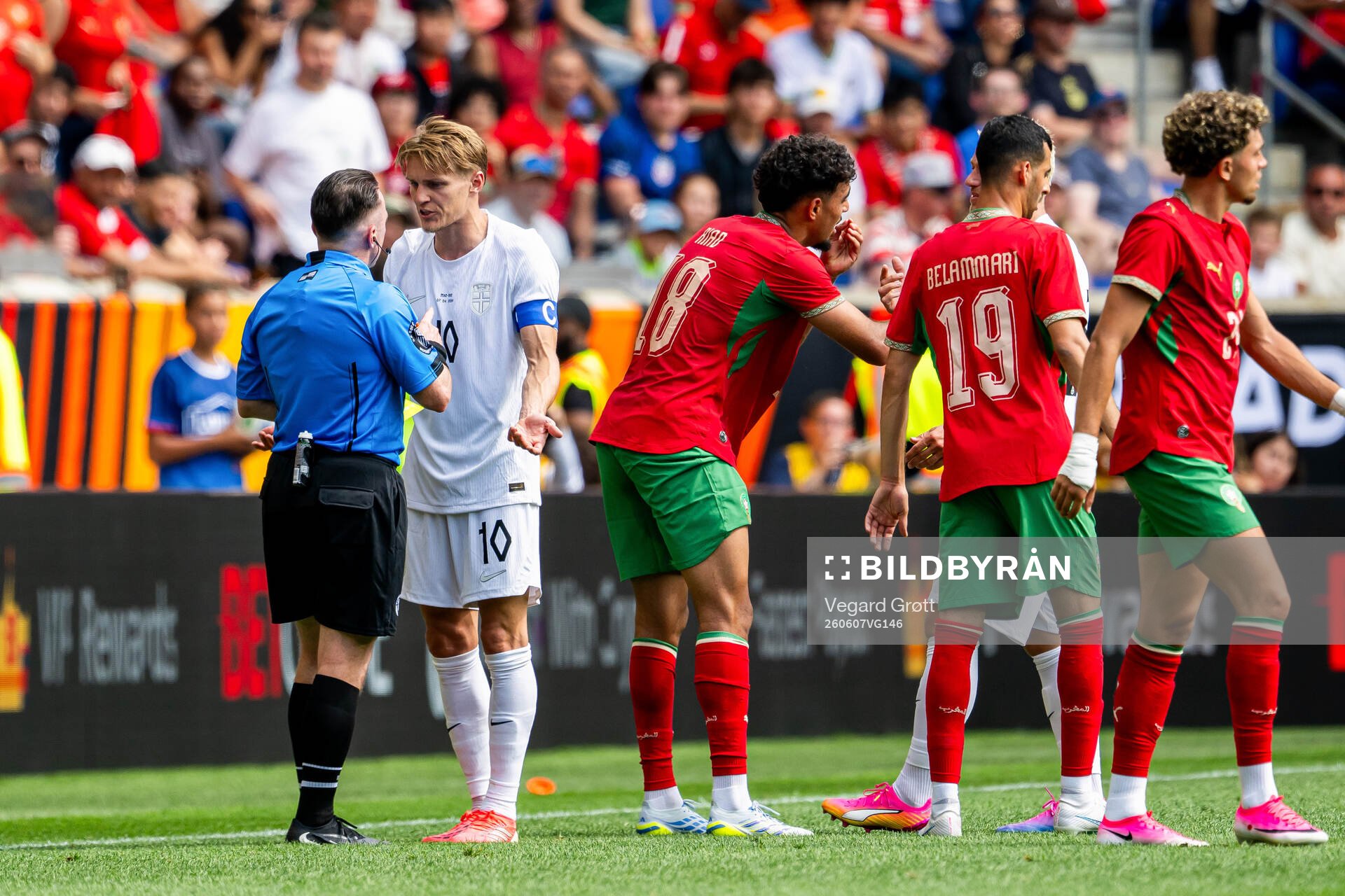 Martin Ødegaard of Norway argues with the referee