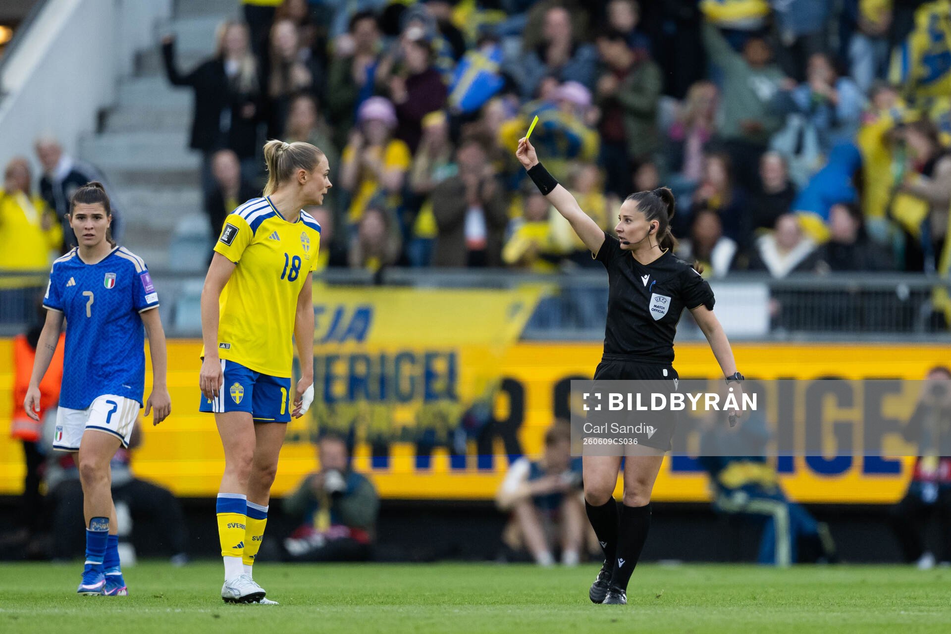 Fridolina Rolfö of Sweden receives a yellow card from