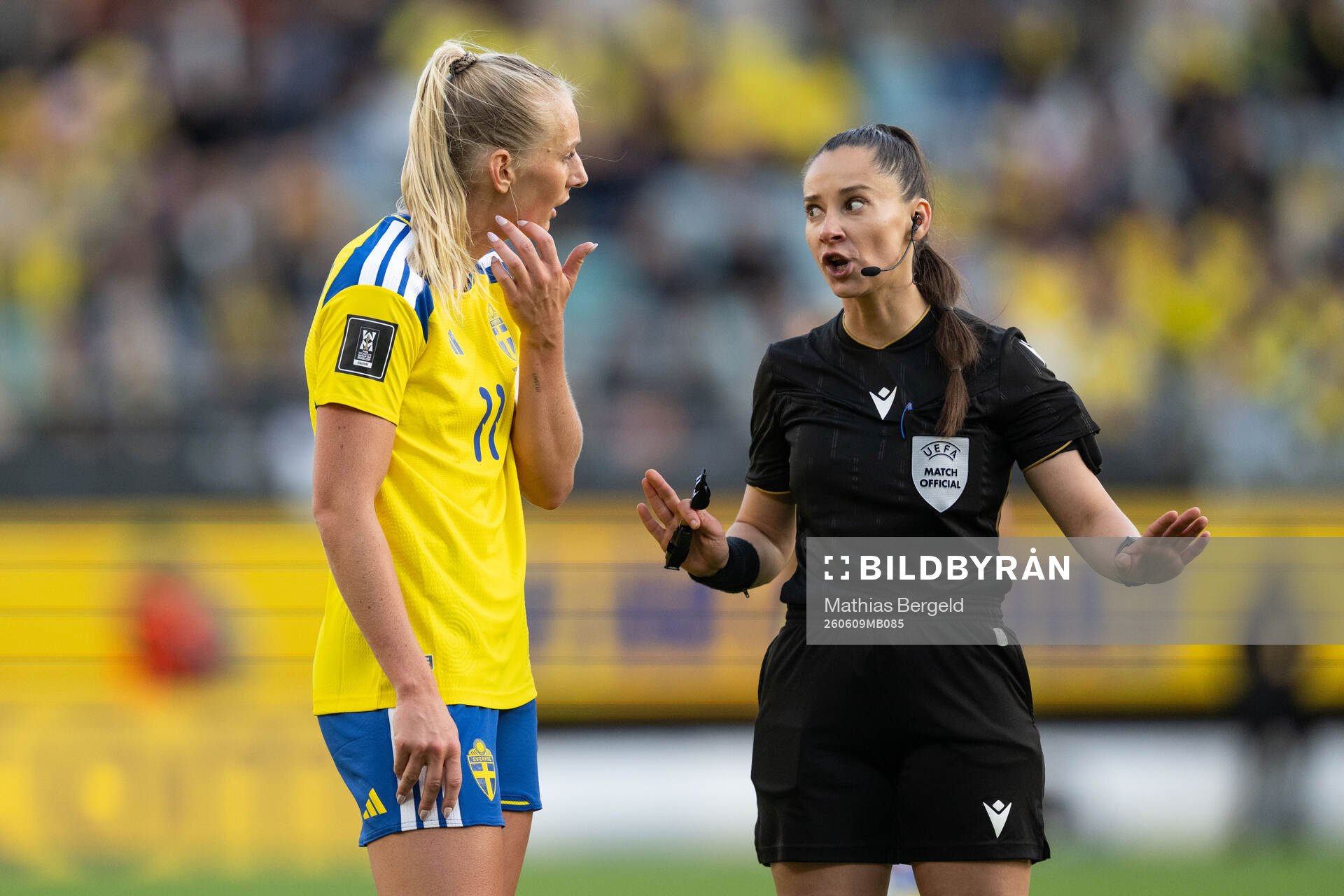 Stina Blackstenius of Sweden and referee Iuliana Demetrescu