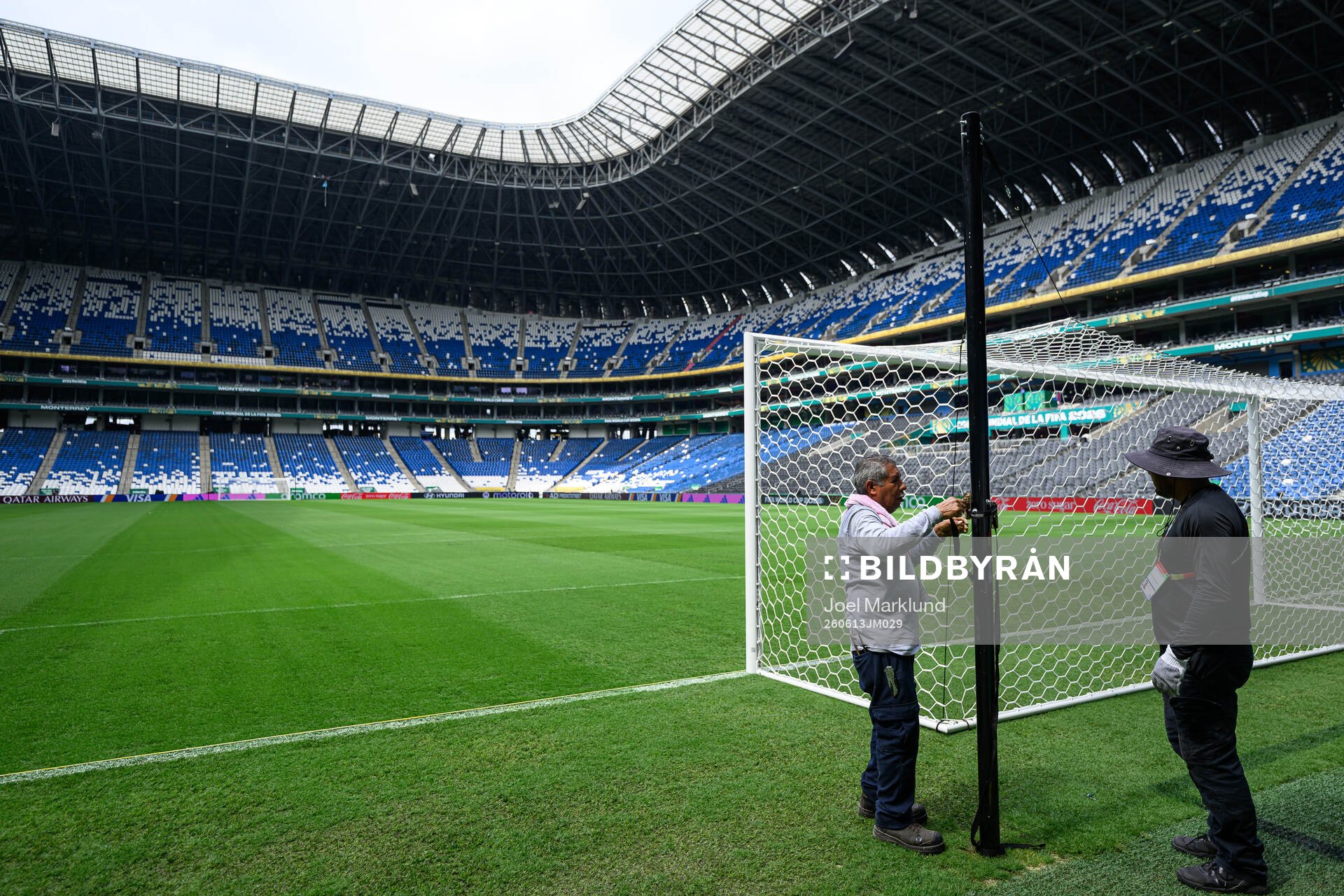 Workers prepare the goal net