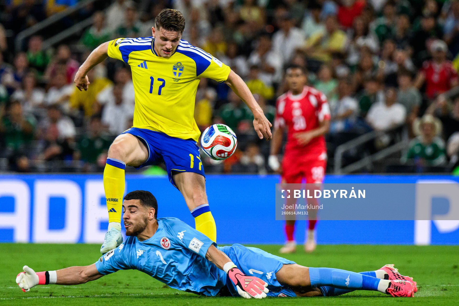 Viktor Gyökeres of Sweden and goalkeeper Mouhib Chamakh of