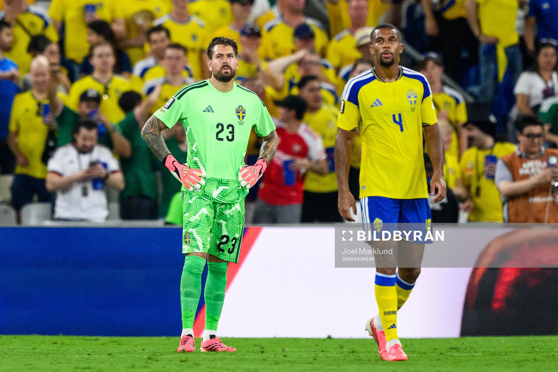 goalkeeper Kristoffer Nordfeldt and Isak Hien of Sweden