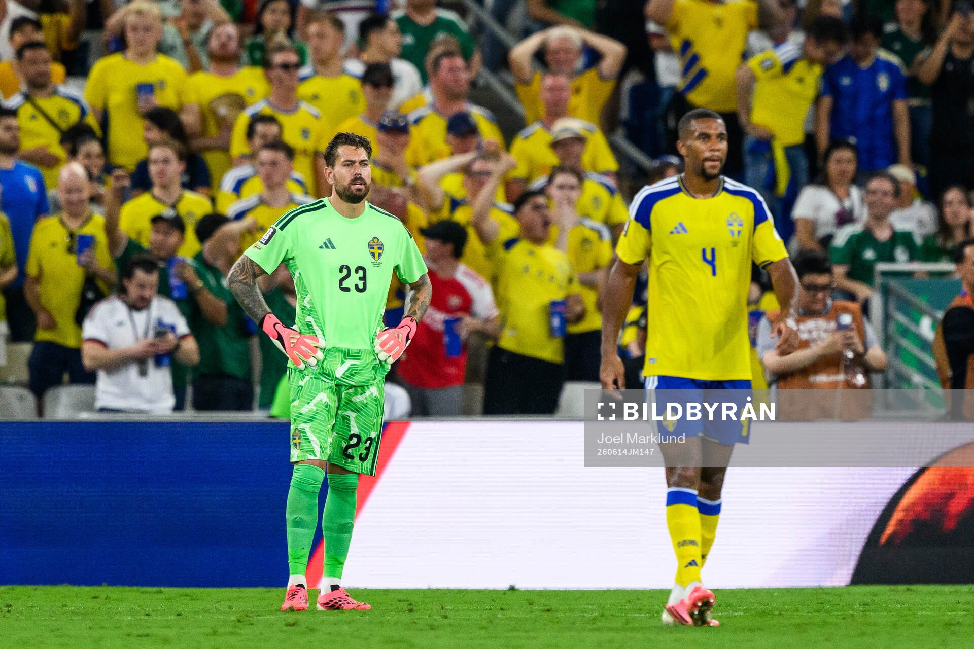 goalkeeper Kristoffer Nordfeldt and Isak Hien of Sweden