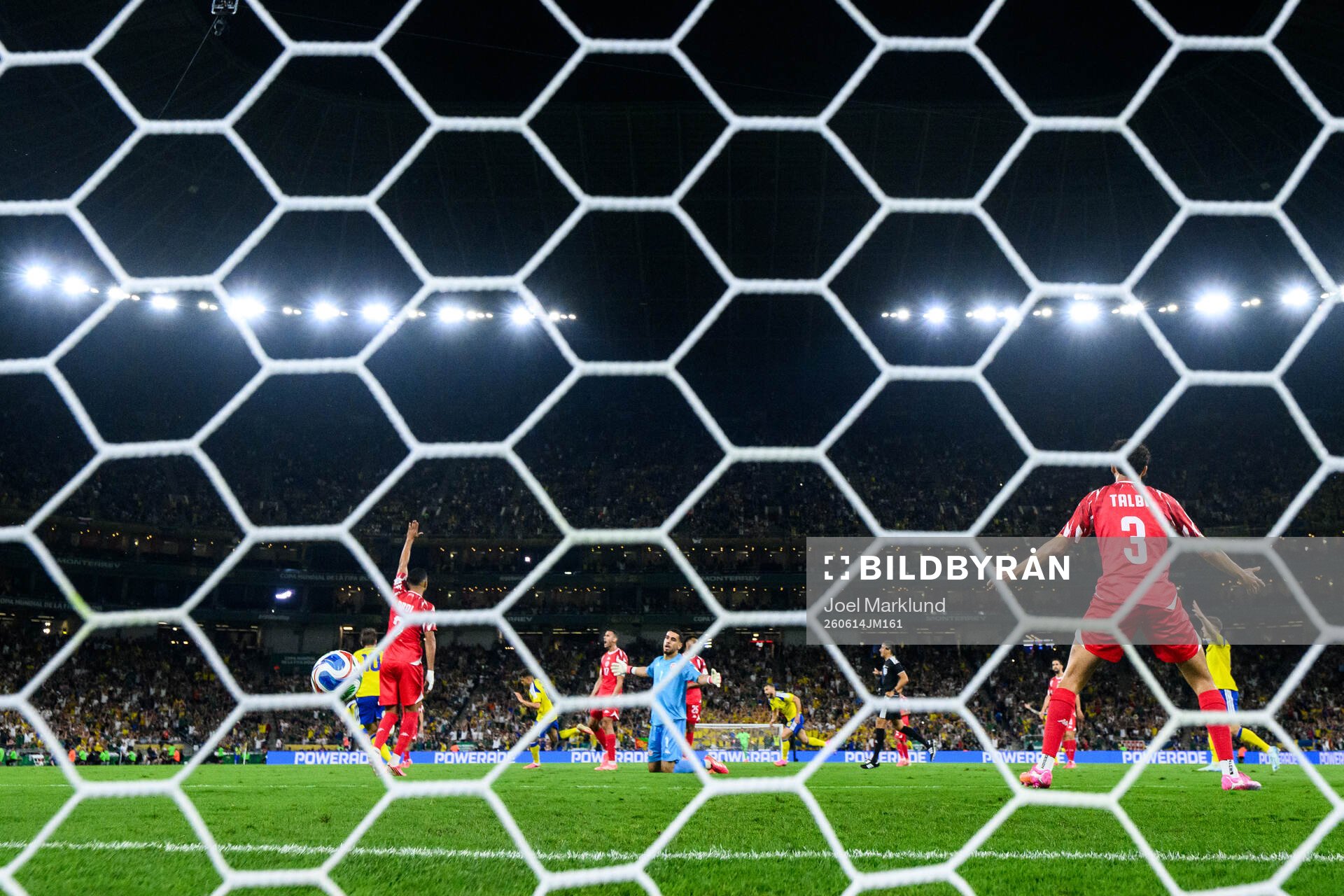goalkeeper Mouhib Chamakh and Montassar Talbi of Tunisia