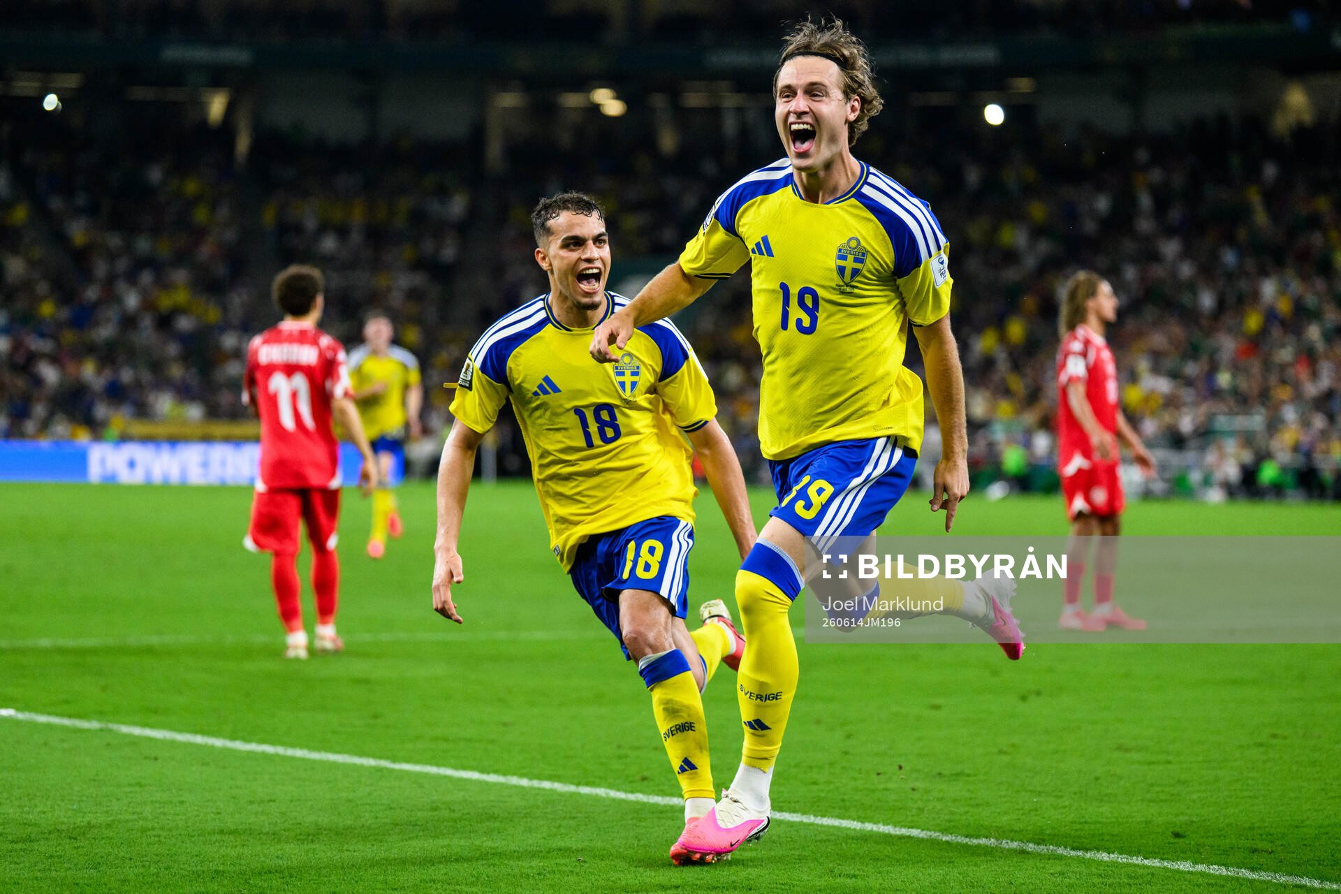 Yasin Ayari and Mattias Svanberg of Sweden celebrate