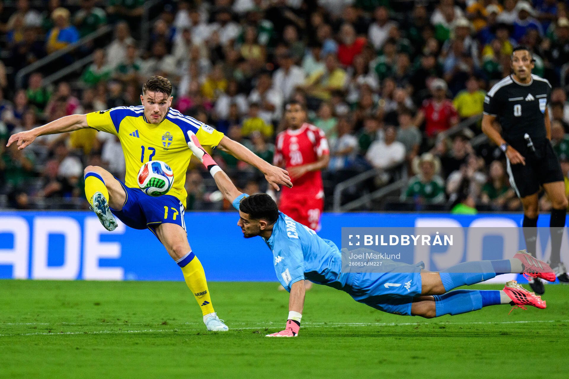 Viktor Gyökeres of Sweden and goalkeeper Mouhib Chamakh of