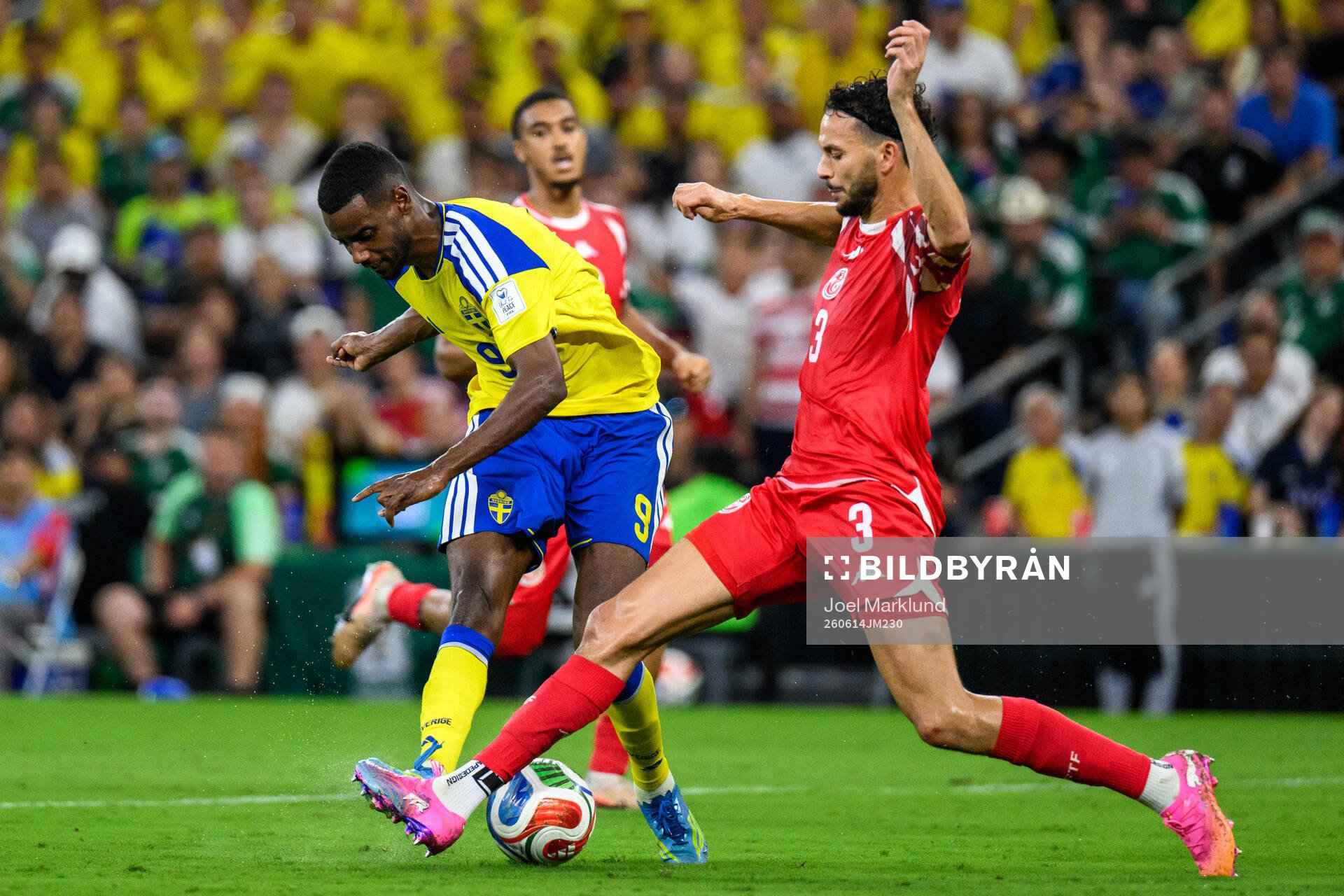 Alexander Isak of Sweden and Montassar Talbi of Tunisia