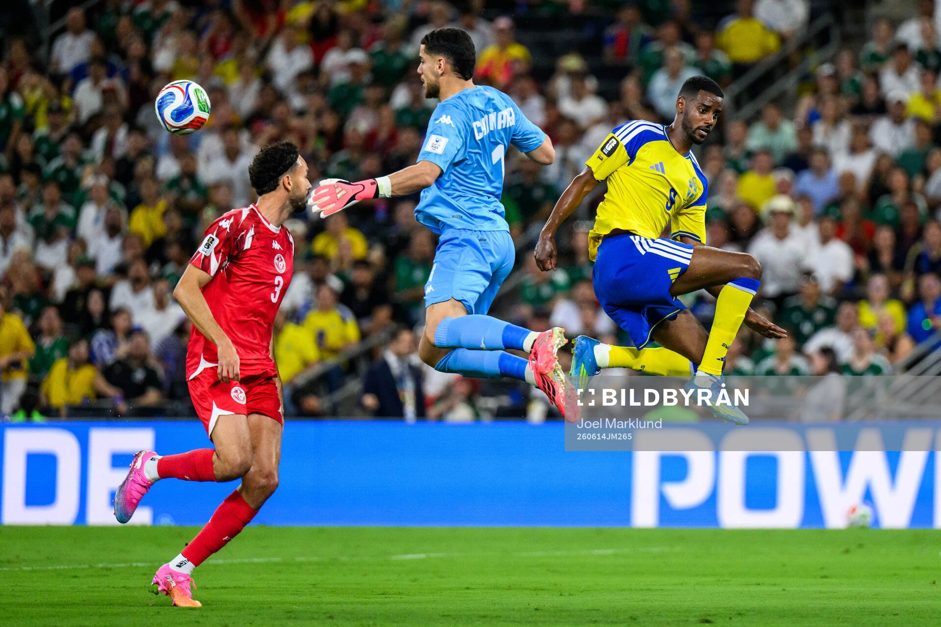 Montassar Talbi and goalkeeper Mouhib Chamakh of Tunisia