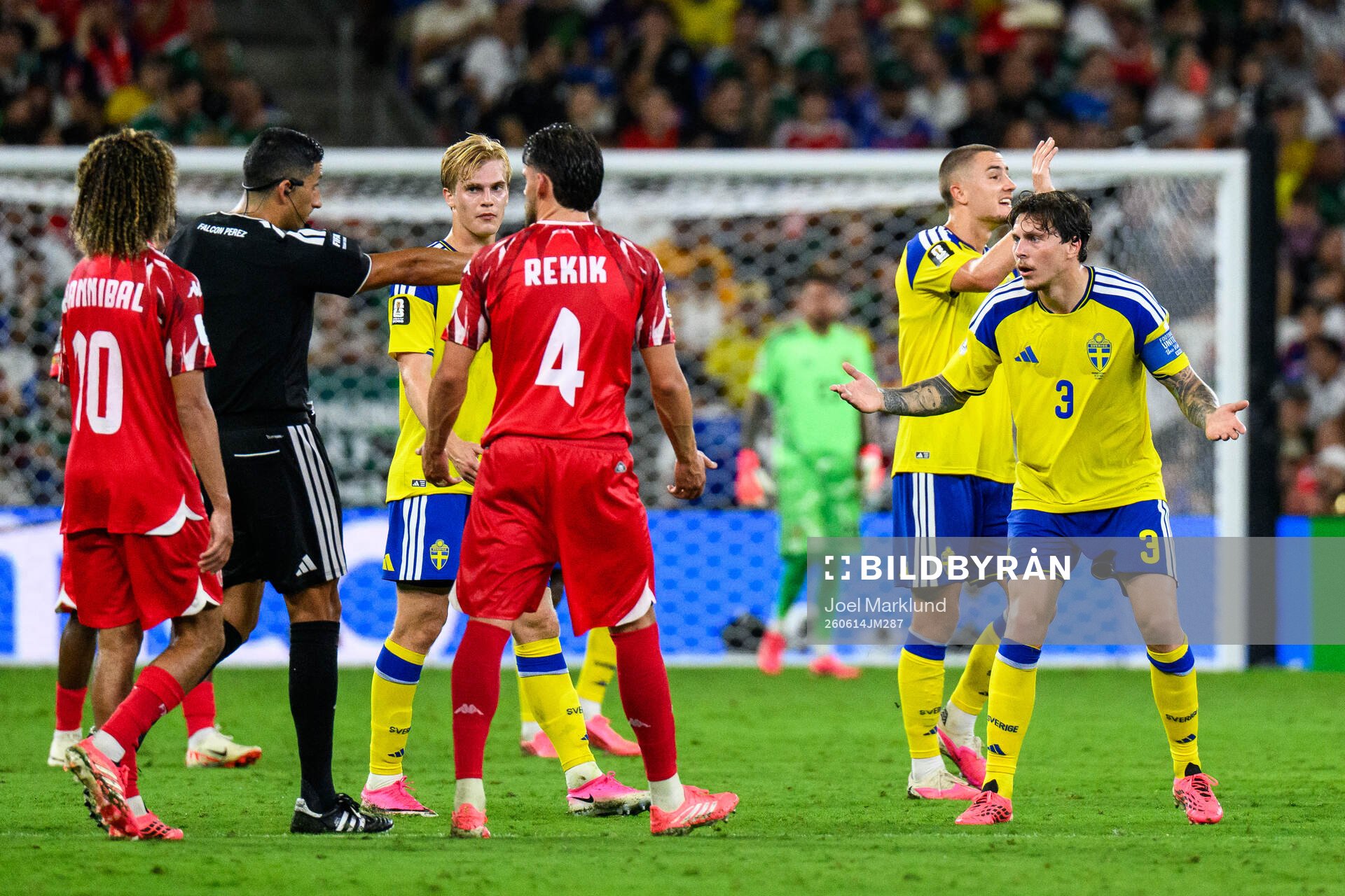 Victor Nilsson Lindelöf of Sweden and Referee Yael Falcon