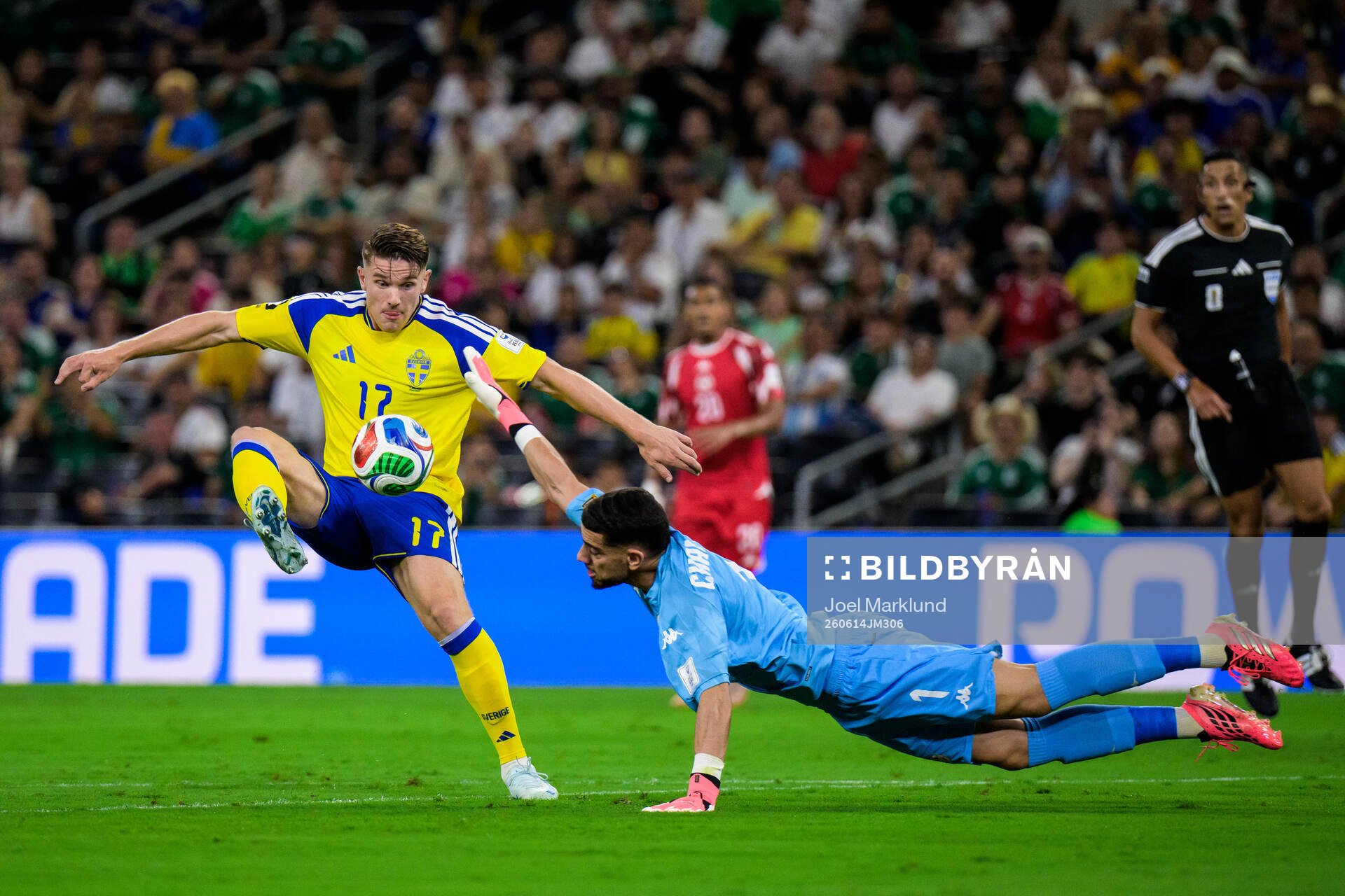 Viktor Gyökeres of Sweden and goalkeeper Mouhib Chamakh of