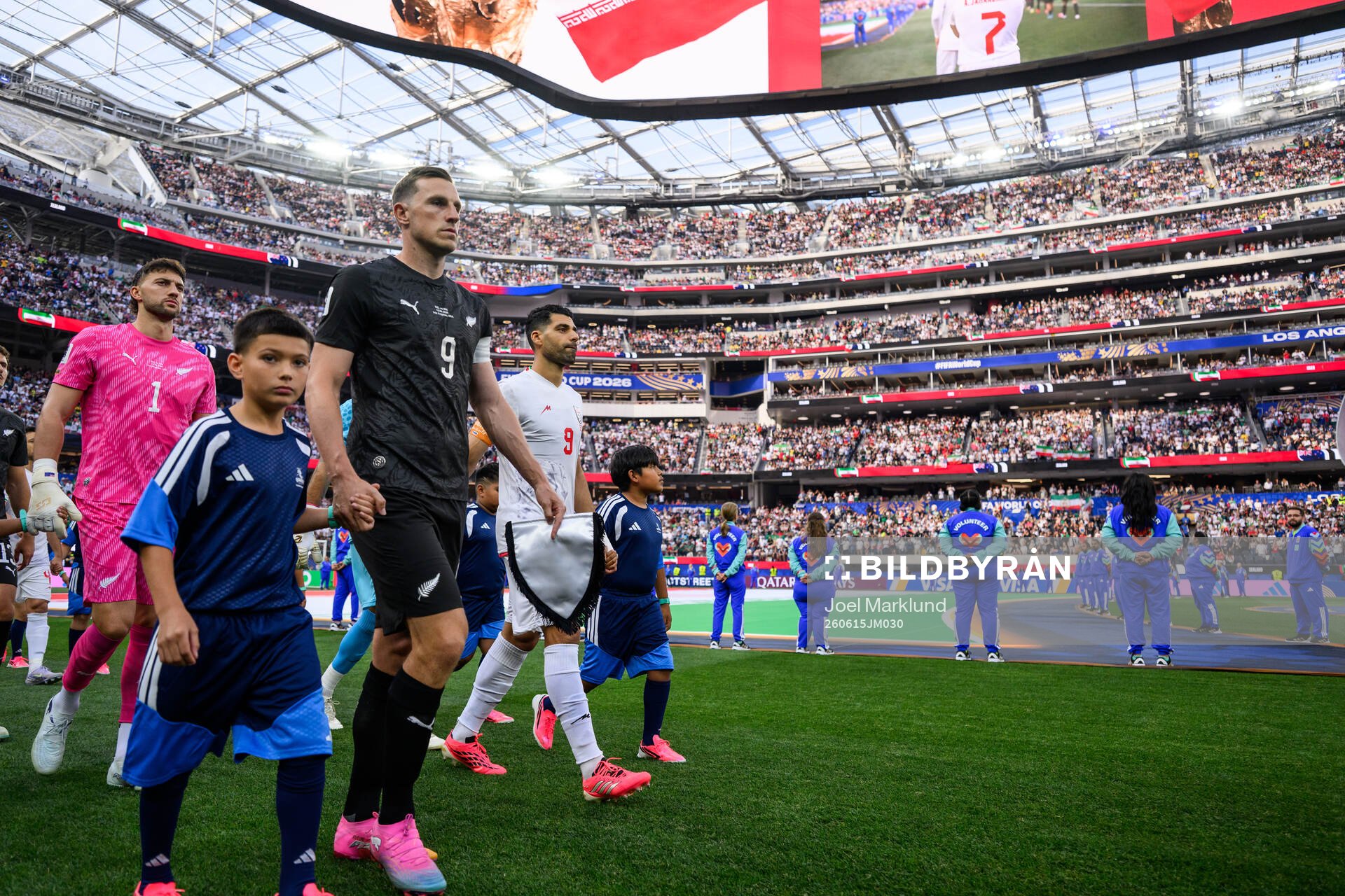goalkeeper Max Crocombe and Chris Wood of New Zealand and