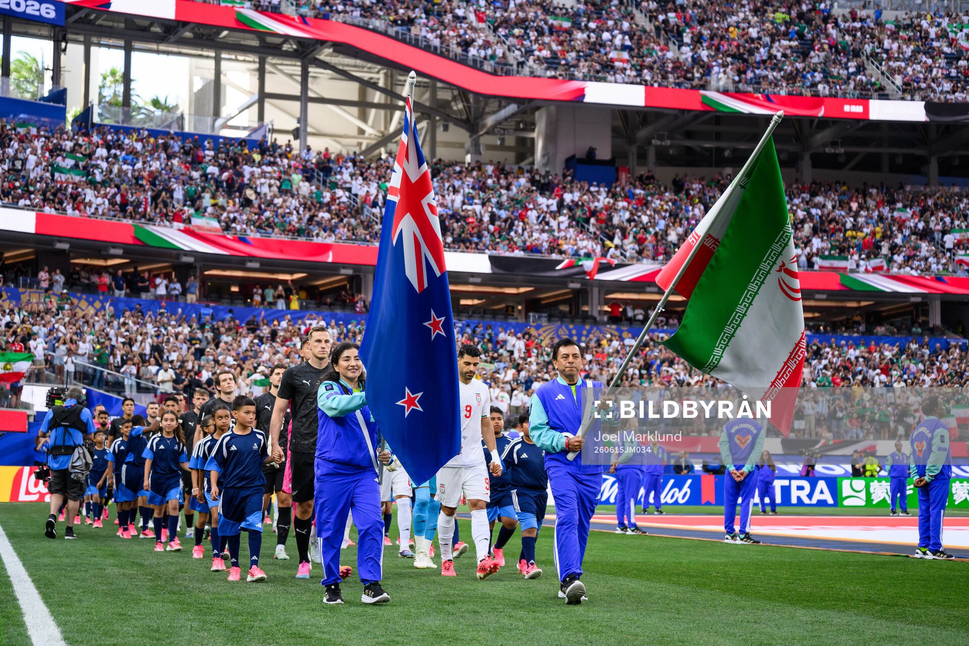 Chris Wood of New Zealand and Mehdi Taremi of Iran