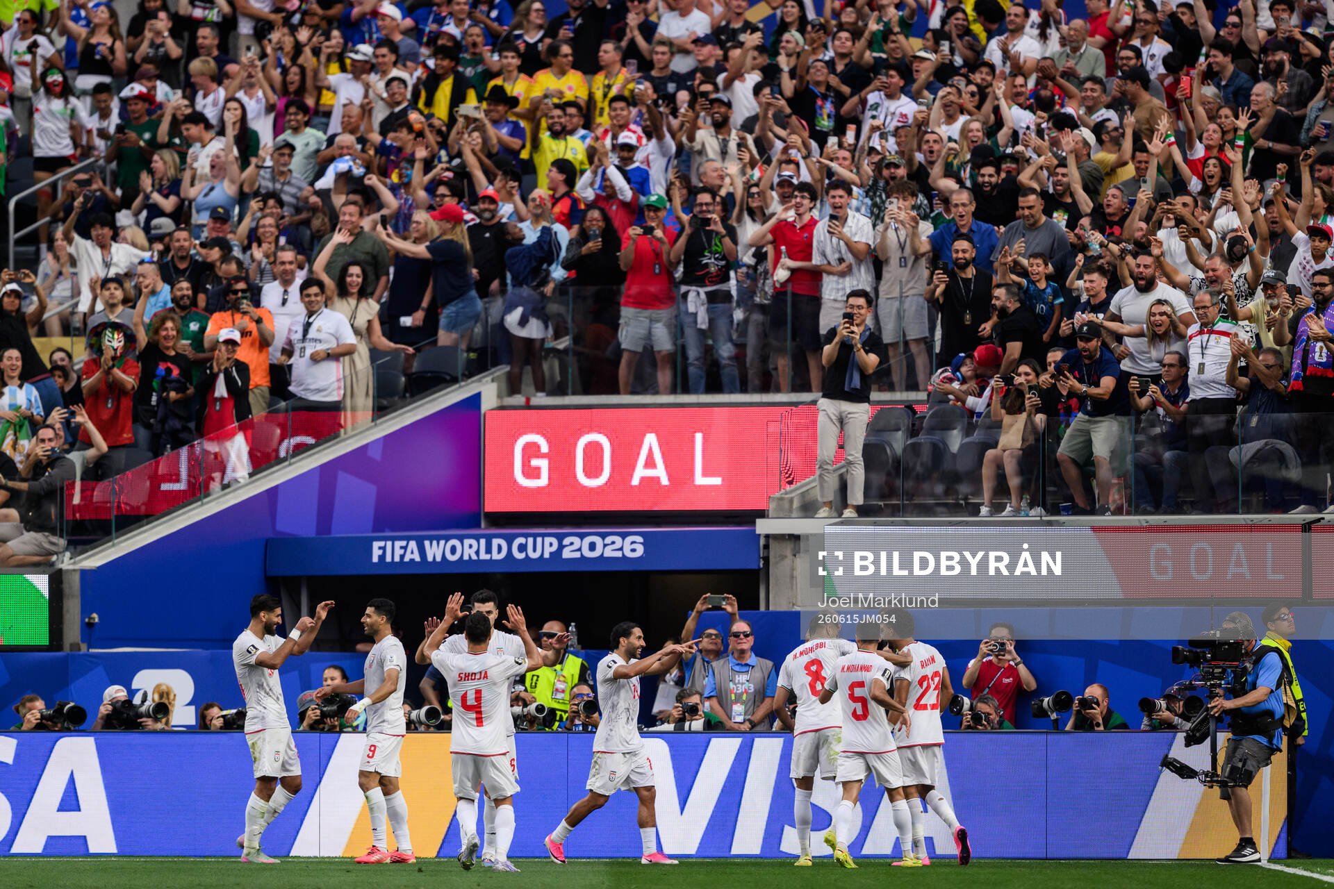 Ramin Rezaeian of Iran celebrate with teammates