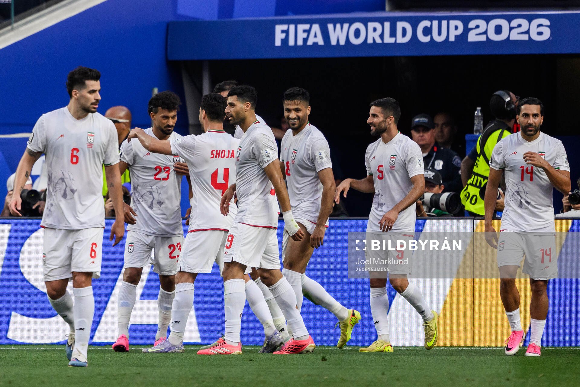 Ramin Rezaeian of Iran celebrate with teammates