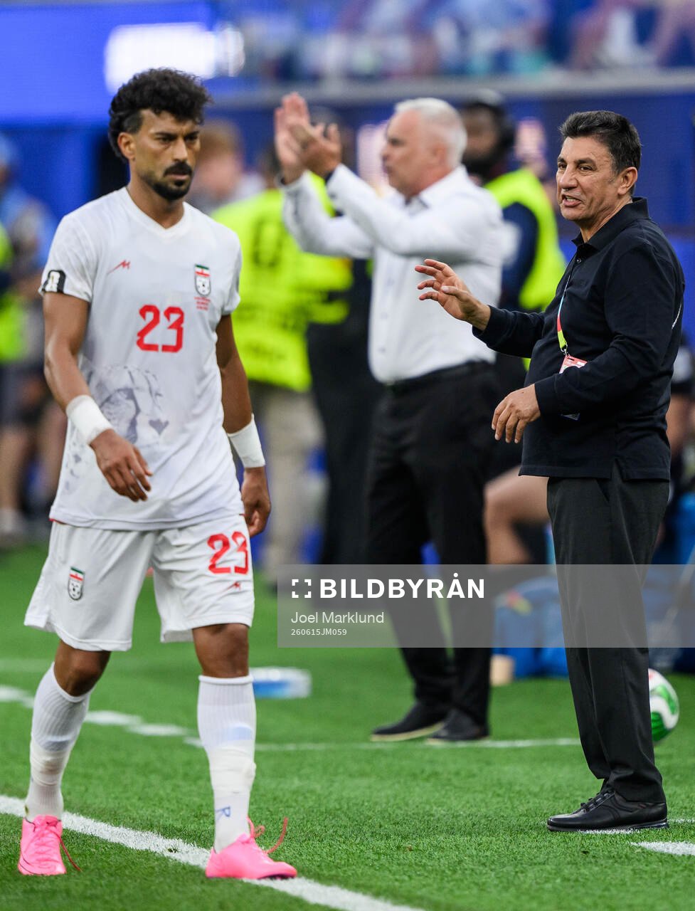 Ramin Rezaeian and Head coach Amir Ghalehnoy of Iran