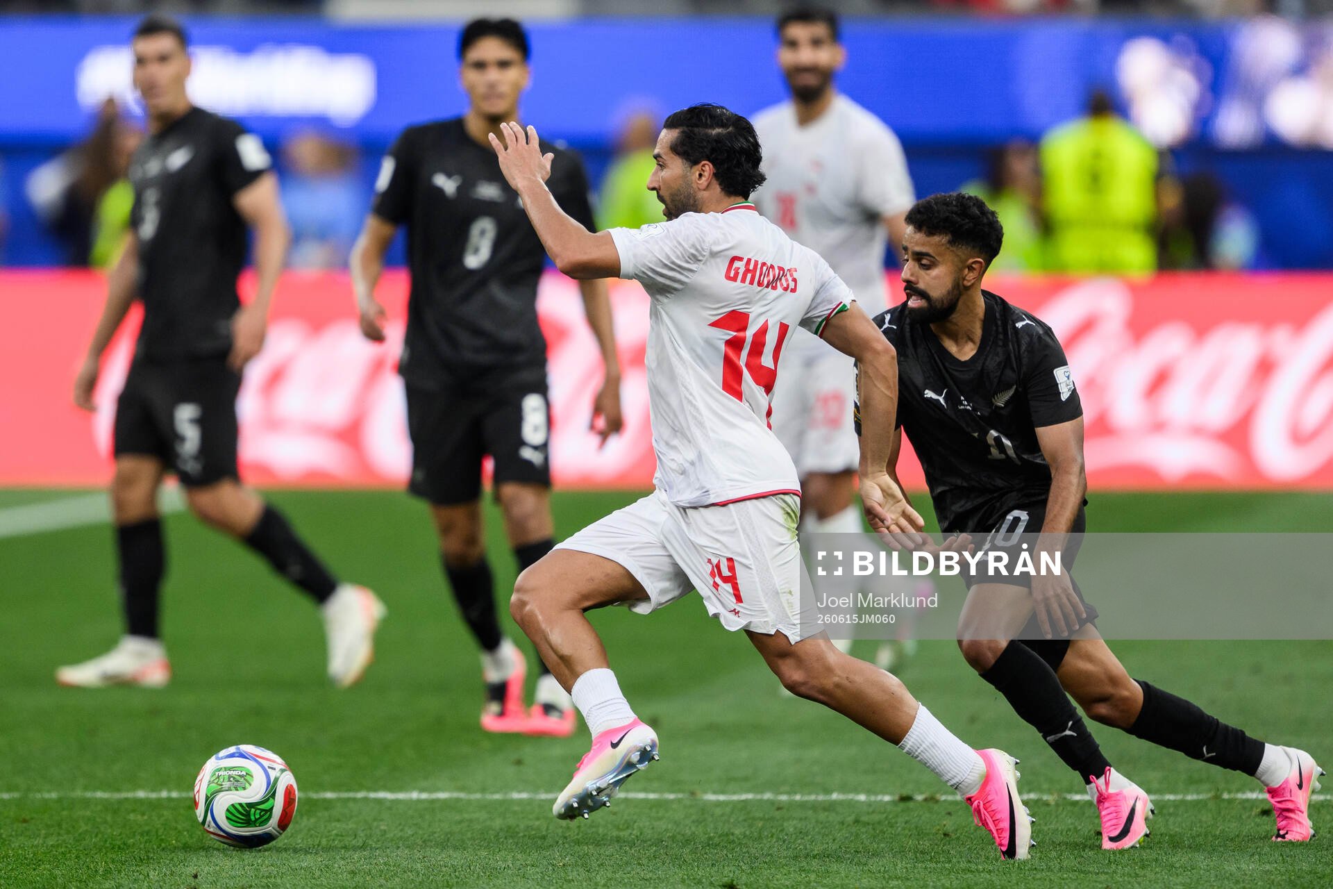 Saman Ghoddos of Iran and Sarpreet Singh of New Zealand