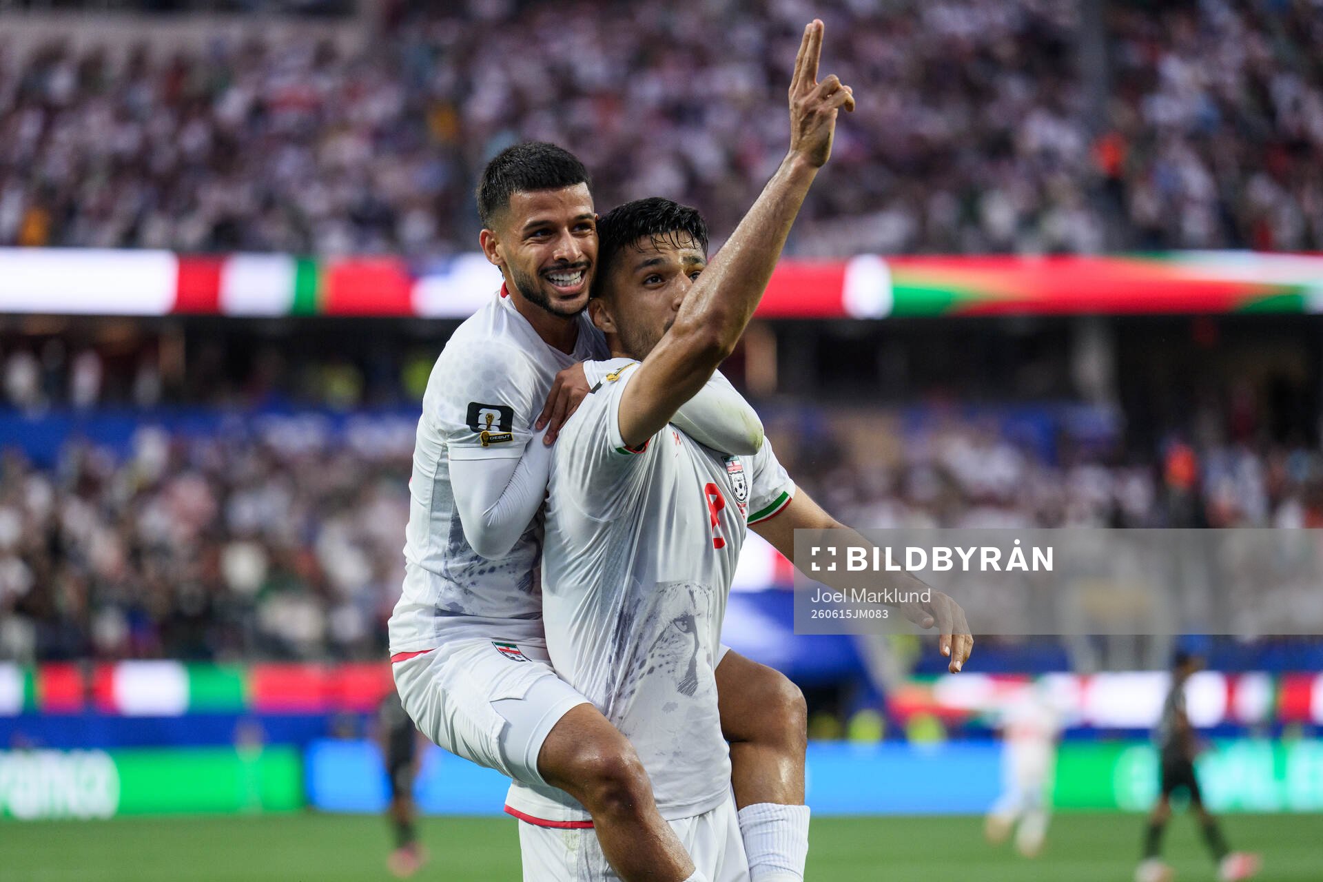 Mehdi Ghayedi and Mohammad Mohebbi of Iran celebrate