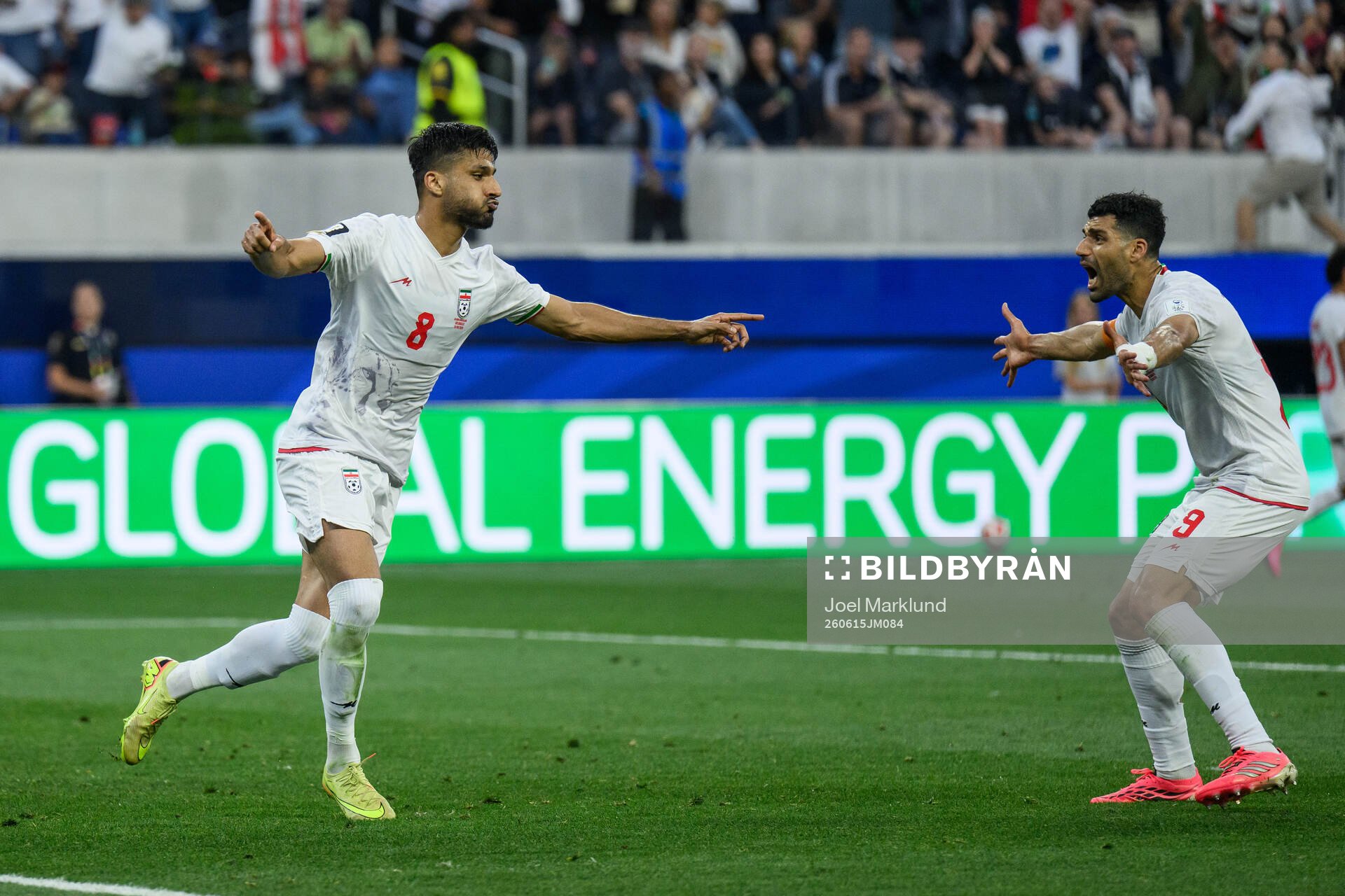 Mohammad Mohebbi and Mehdi Taremi of Iran celebrates