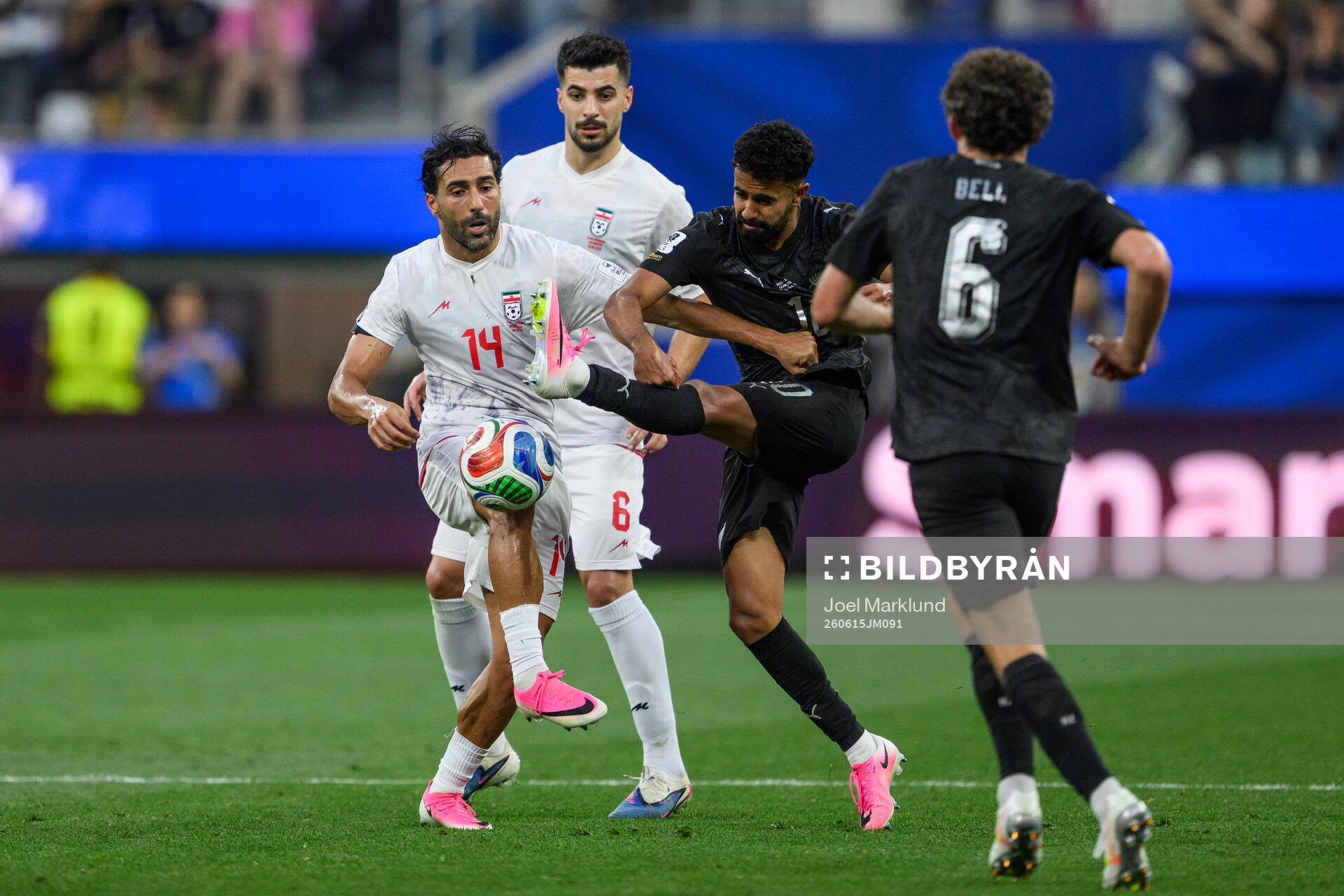 Saman Ghoddos of Iran and Sarpreet Singh of New Zealand