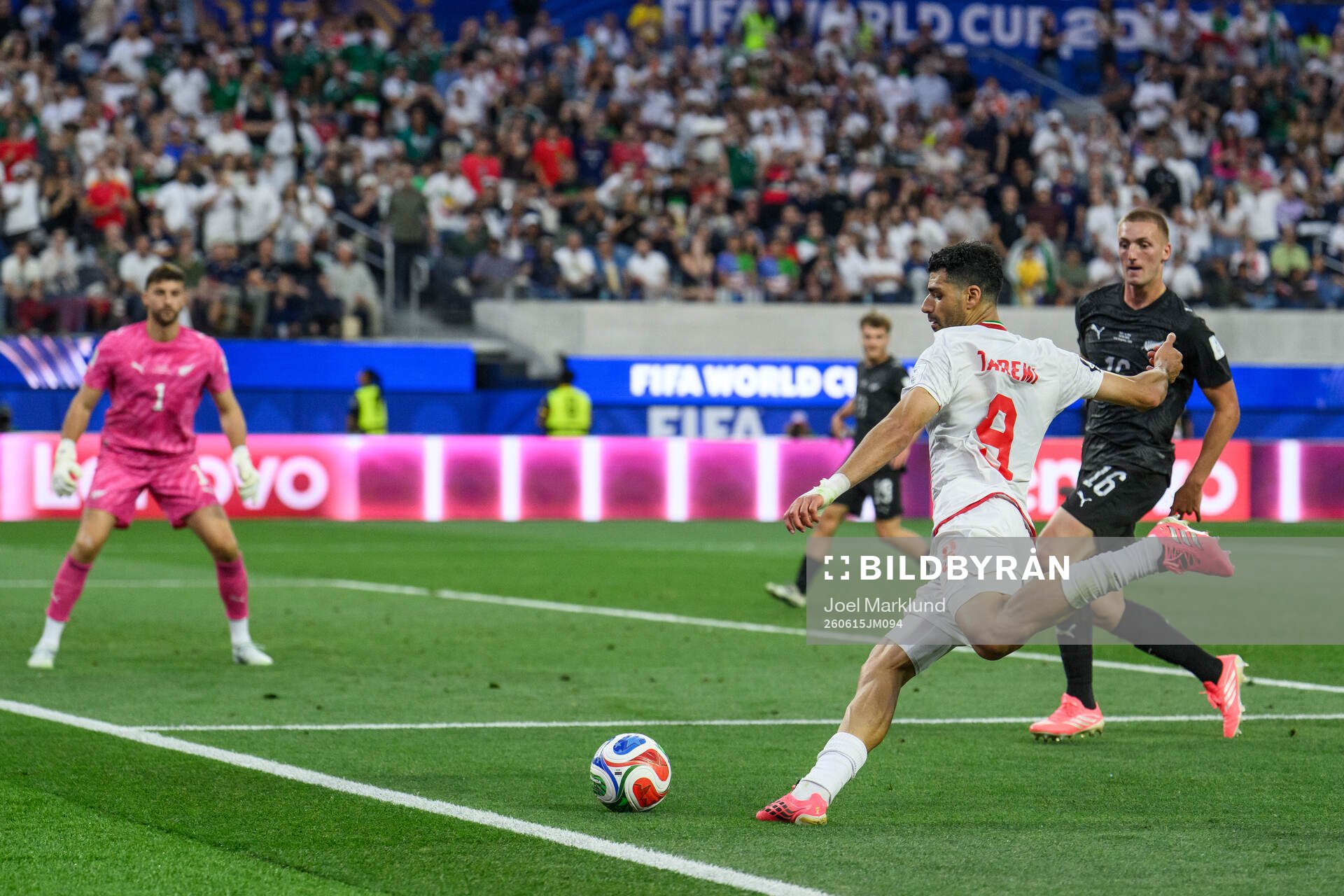 Mehdi Taremi of Iran against goalkeeper Max Crocombe and
