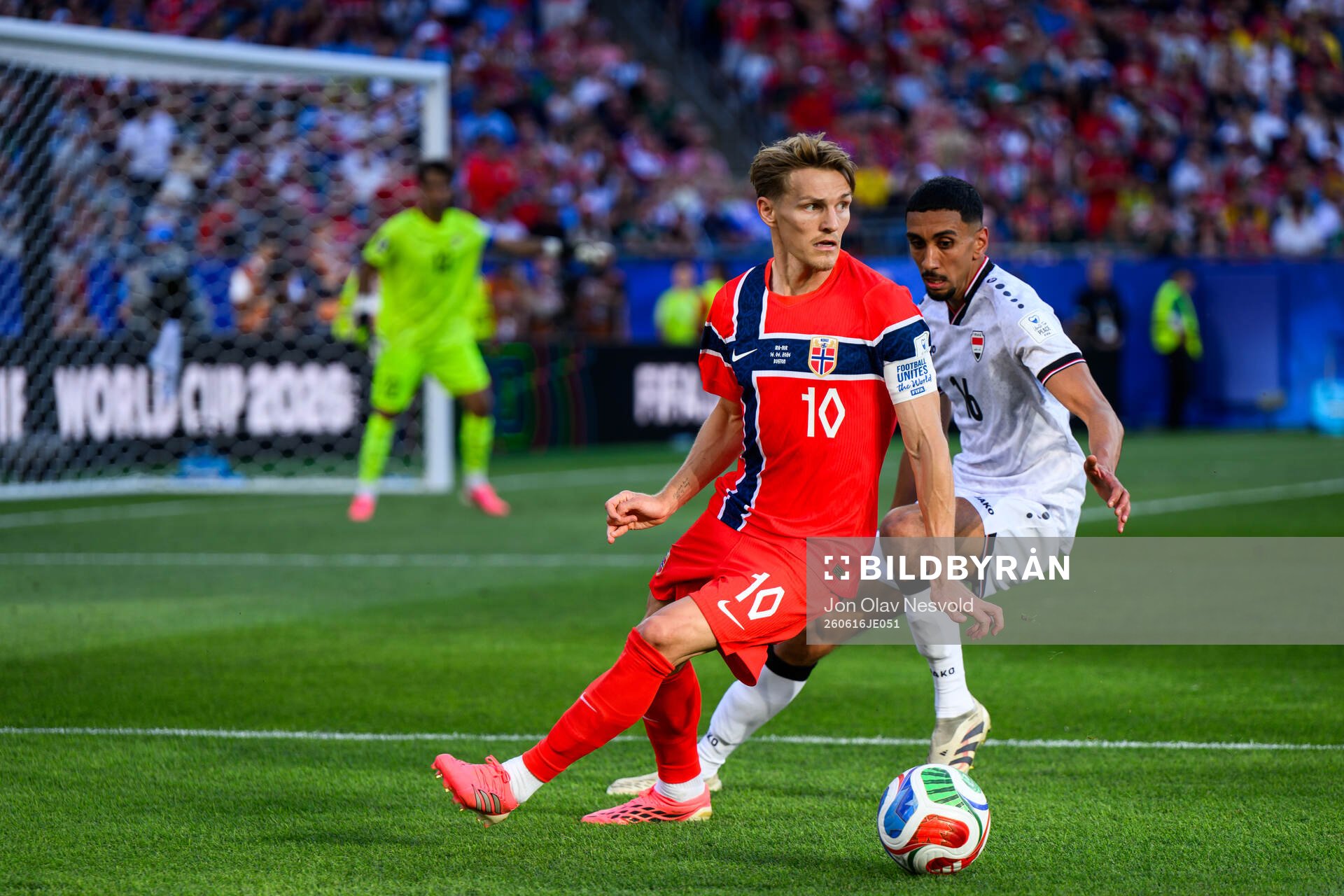 Martin Ødegaard of Norway and Amir Alammari of Iraq