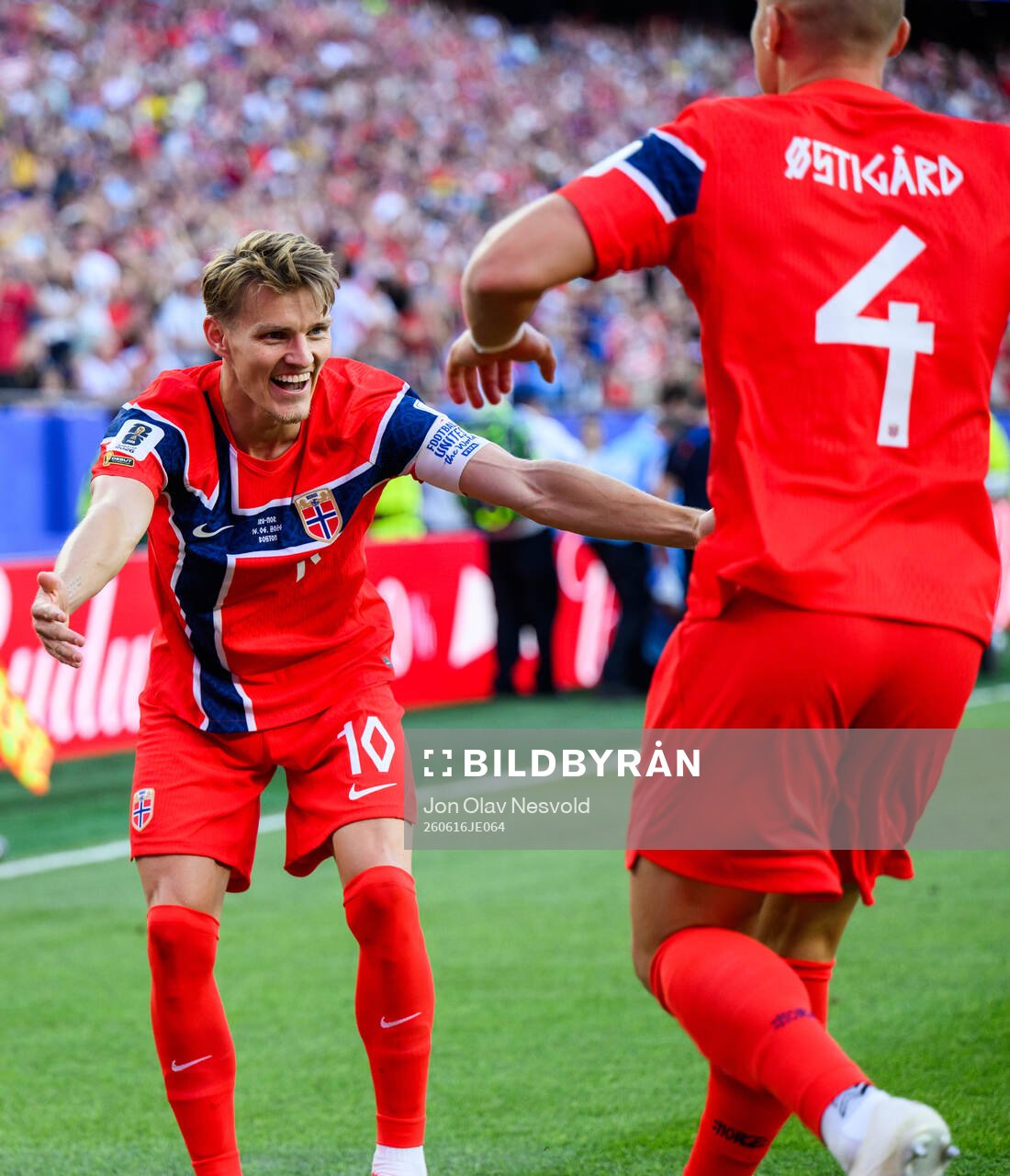 Martin Ødegaard and Leo Østigård of Norway celebrate