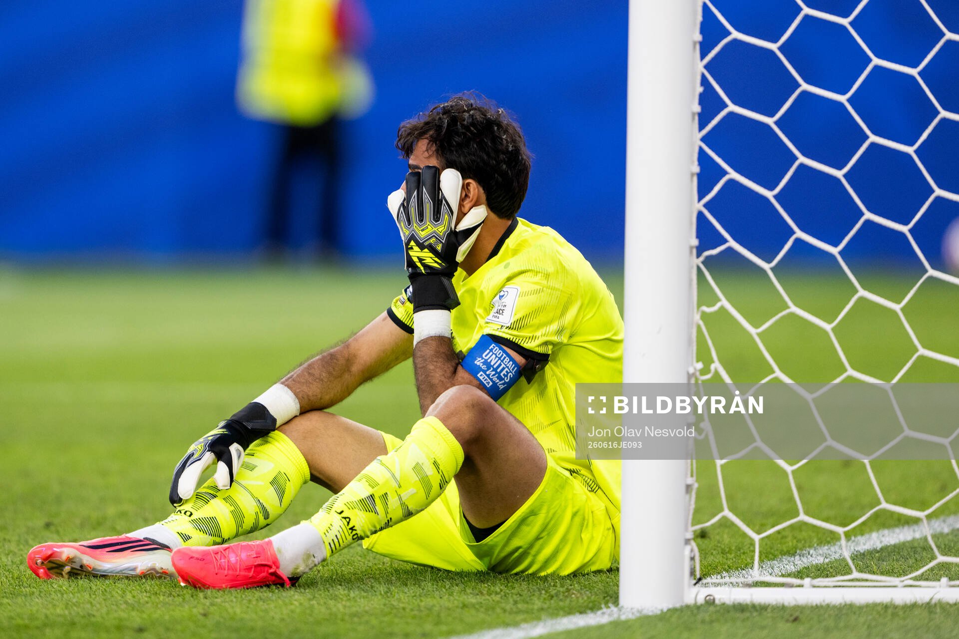 Goalkeeper Jalal Hasan Hachim of Iraq looks dejected