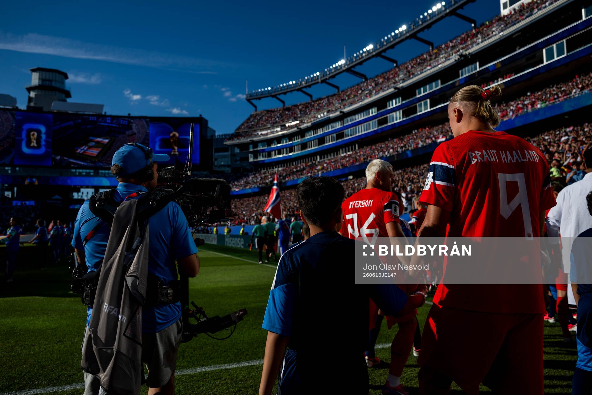 Julian Ryerson and Erling Braut Haaland of Norway enter the