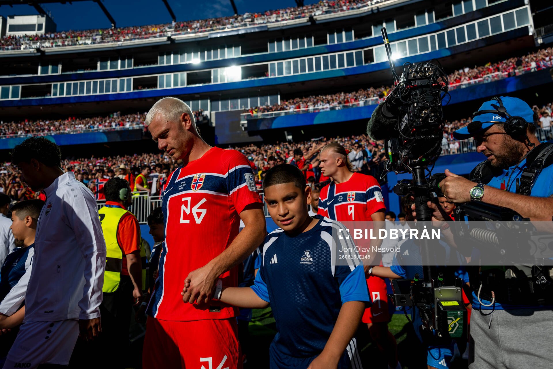 Julian Ryerson and Erling Braut Haaland of Norway enter the