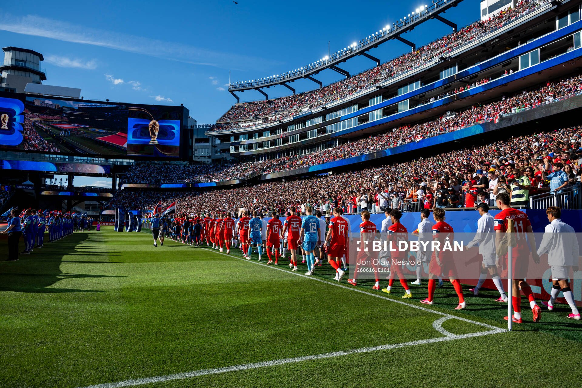 The teams enter the pitch