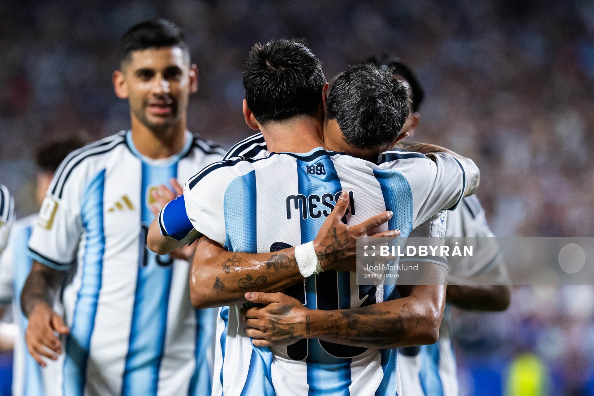 Lionel Messi and Facundo Medina celebrate