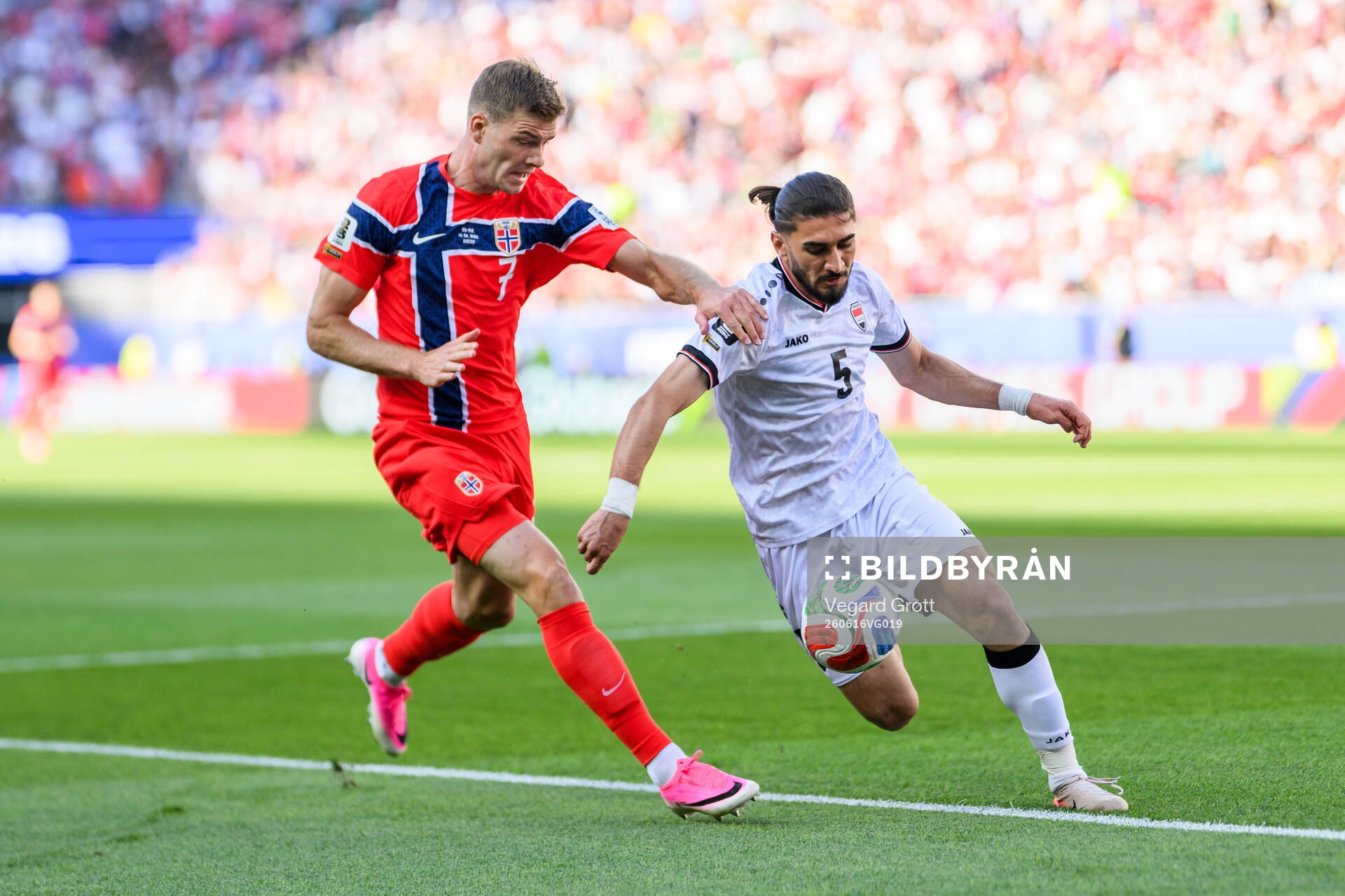 Alexander Sørloth of Norway and Akam Hashim Rahman of Iraq