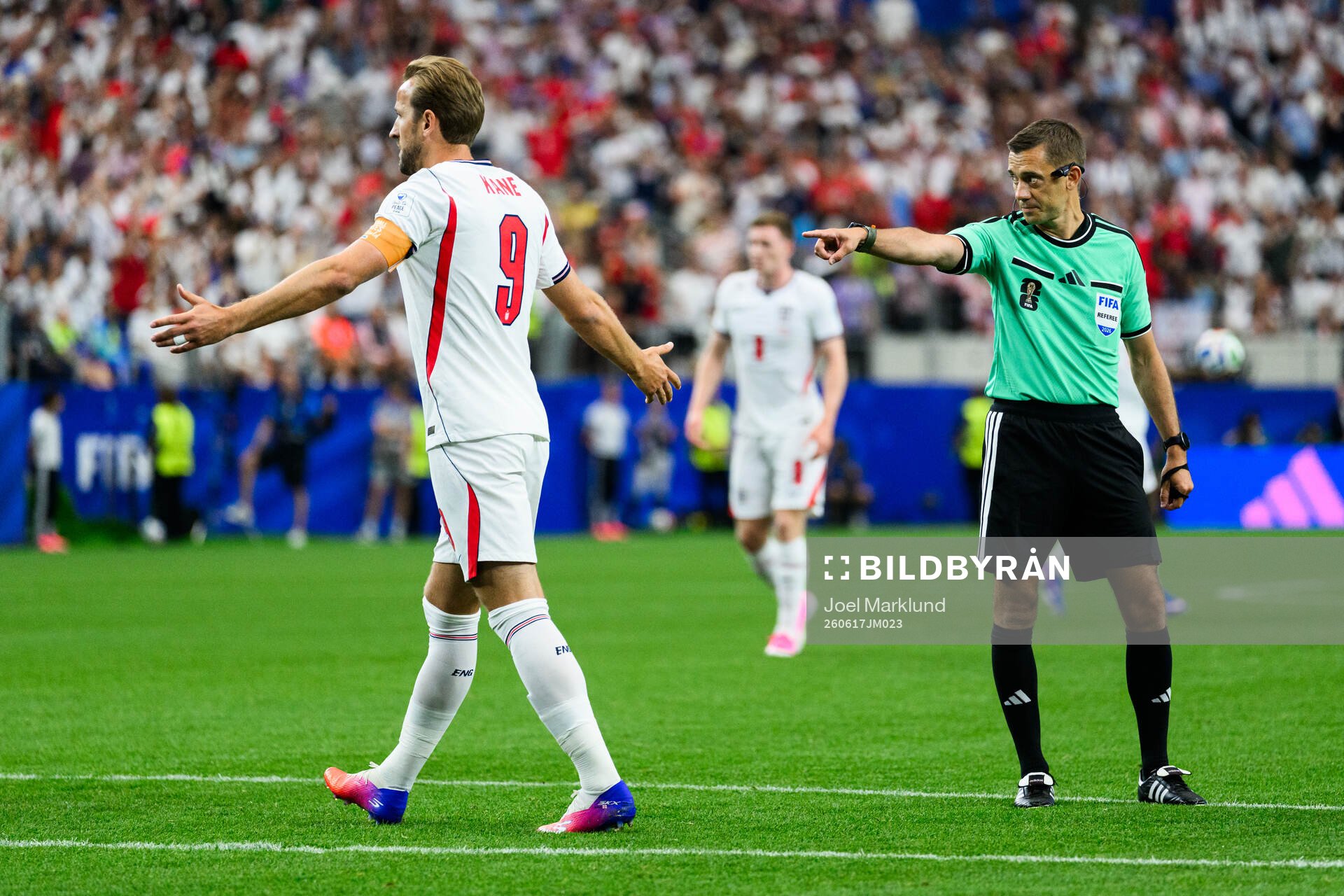 Referee Clement Turpin gives penalty to England