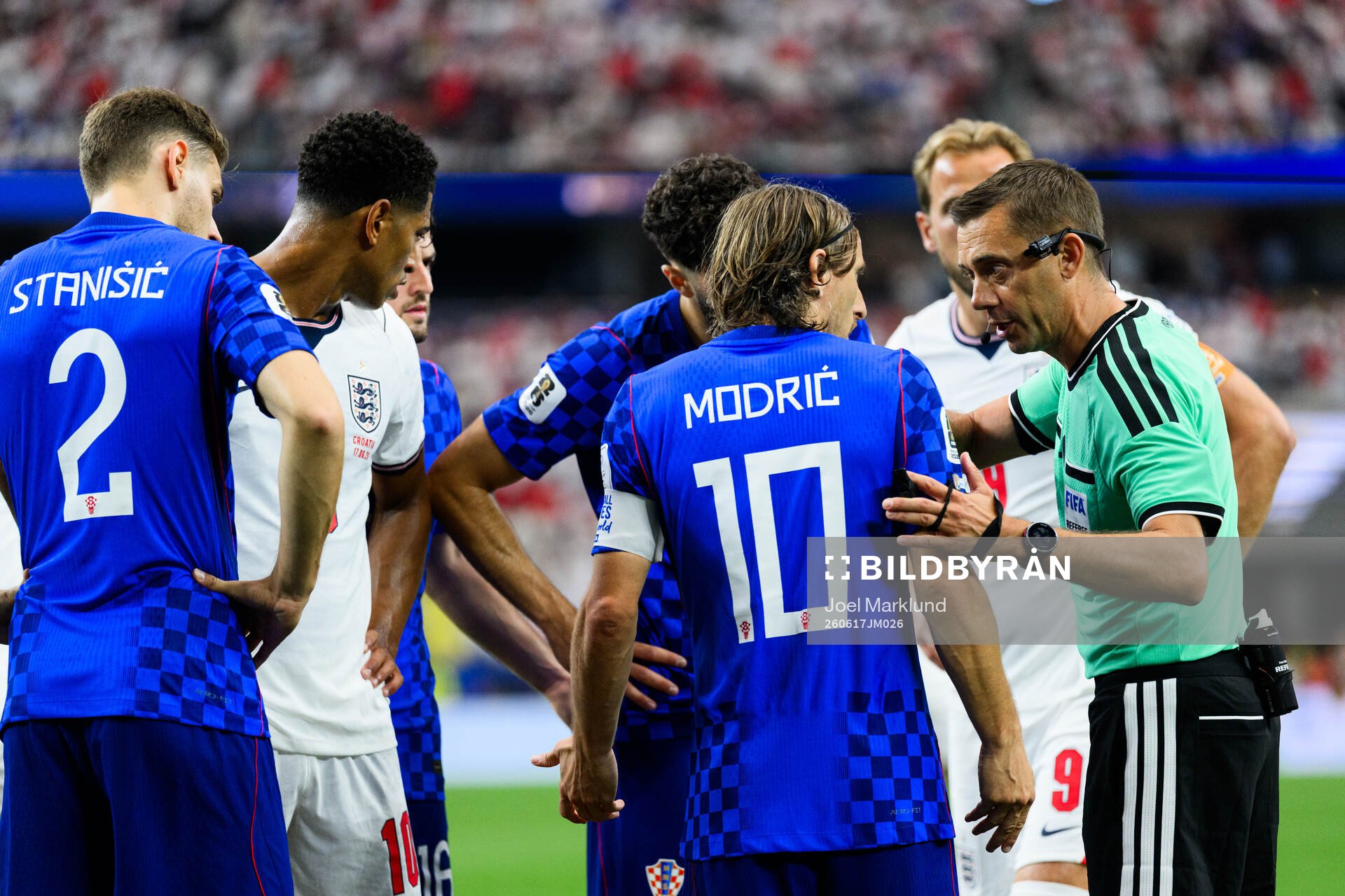 Luka Modric of Croatia and Referee Clement Turpin