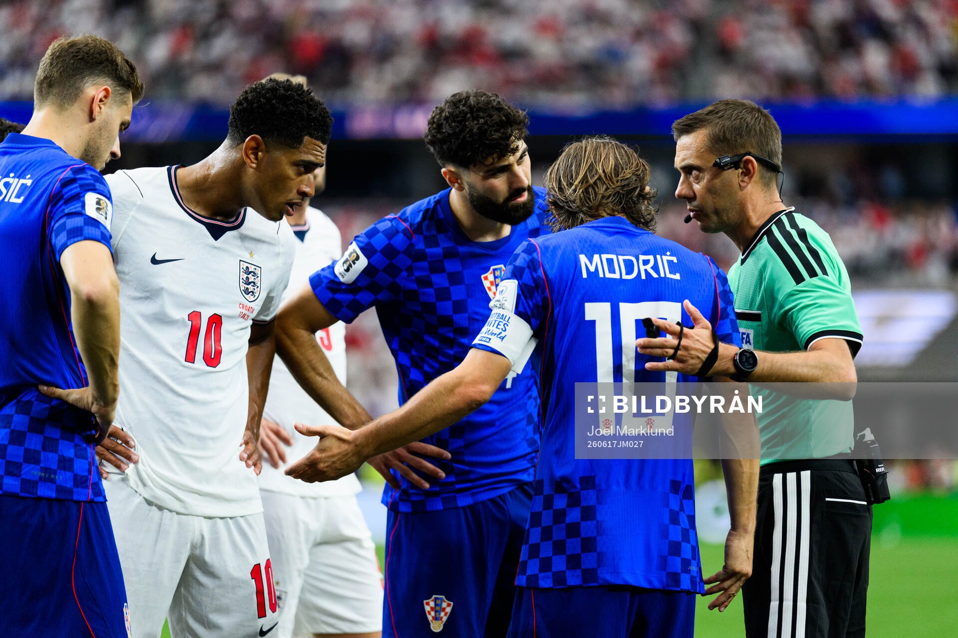 Luka Modric of Croatia and Referee Clement Turpin