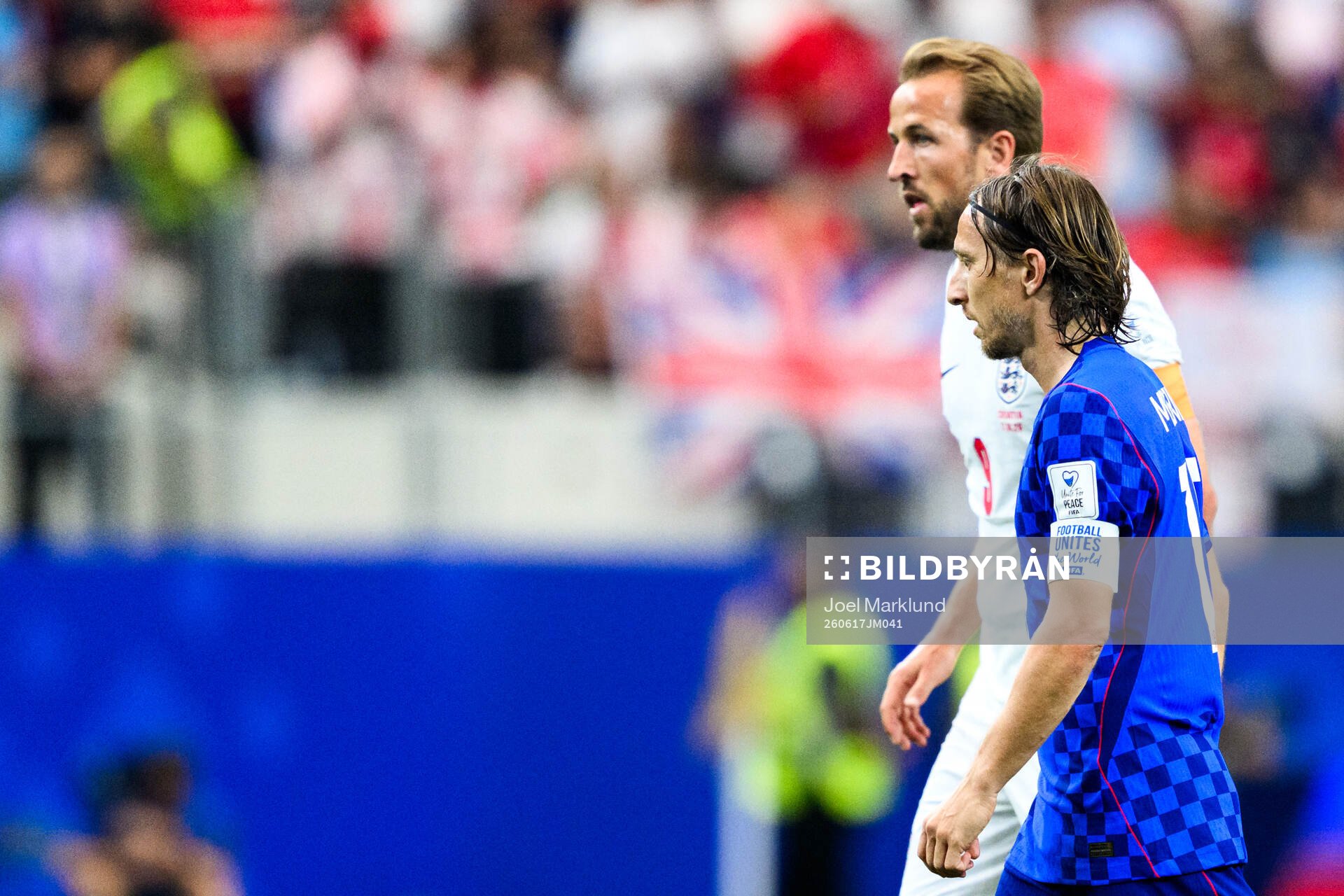 Harry Kane of England and Luka Modric of Croatia