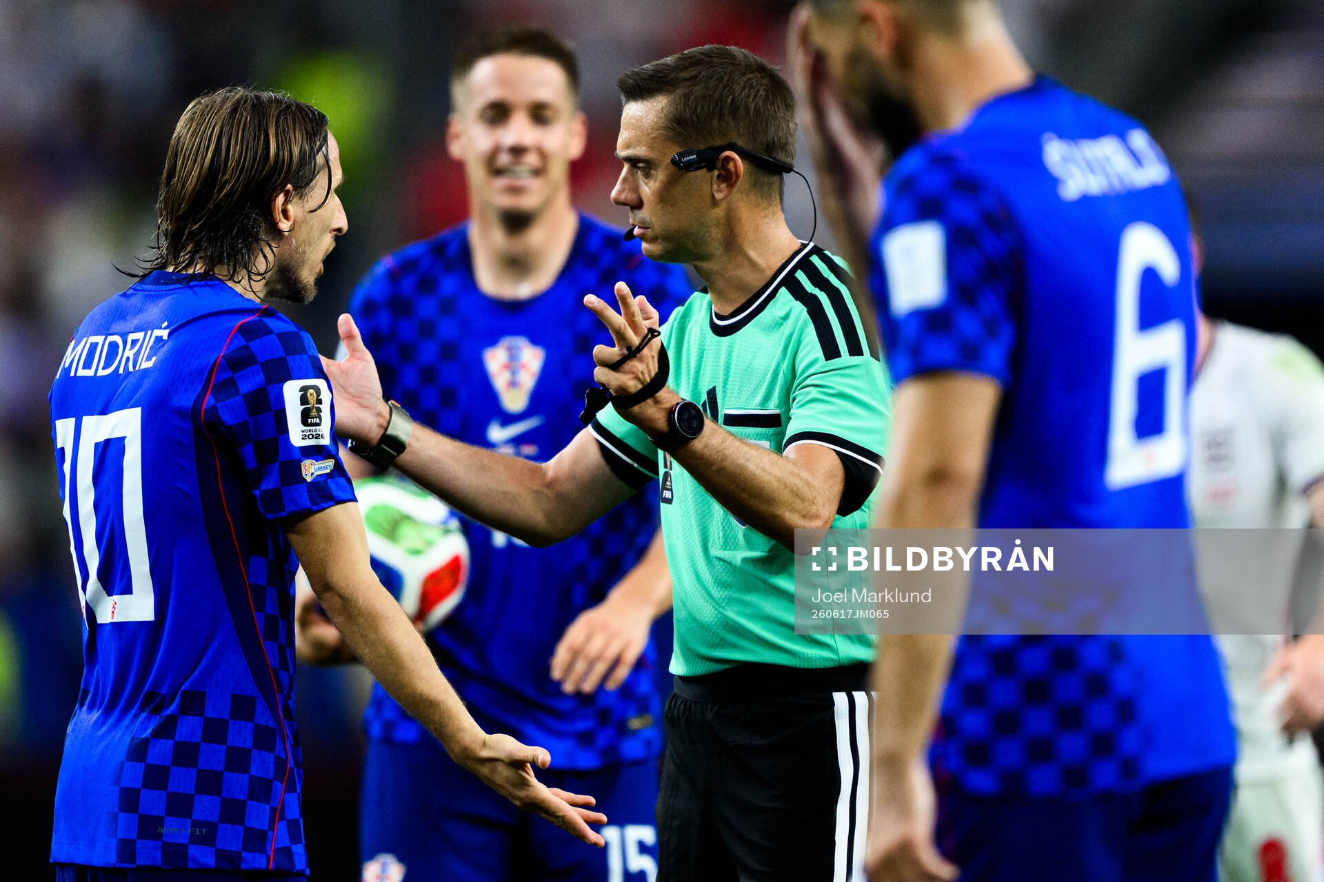 Luka Modric of Croatia and Referee Clement Turpin