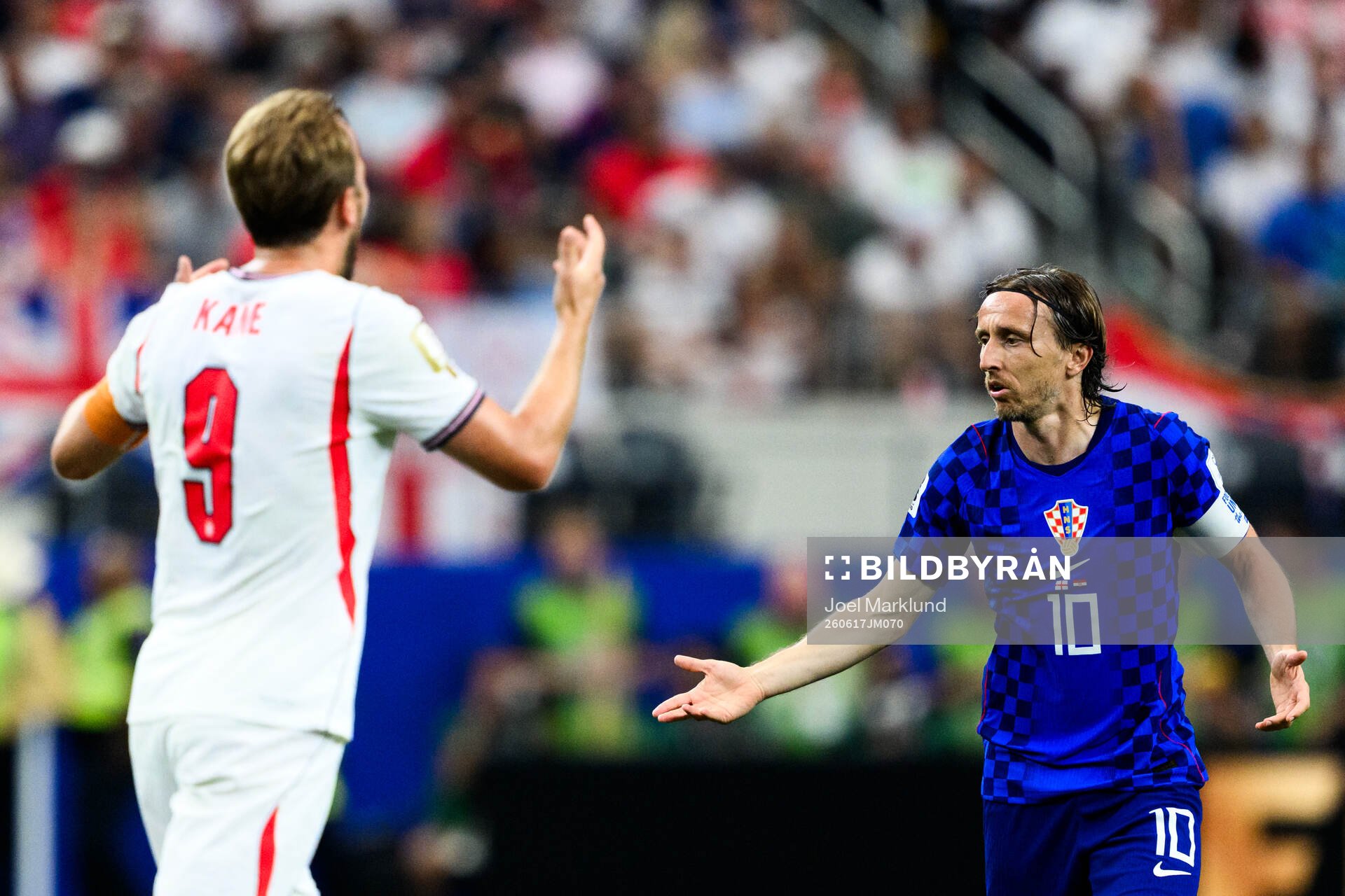 Harry Kane of England and Luka Modric of Croatia