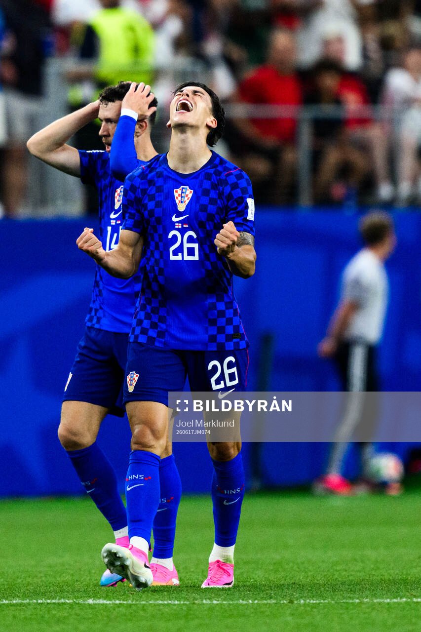 Petar Musa of Croatia celebrates scoring 2-2