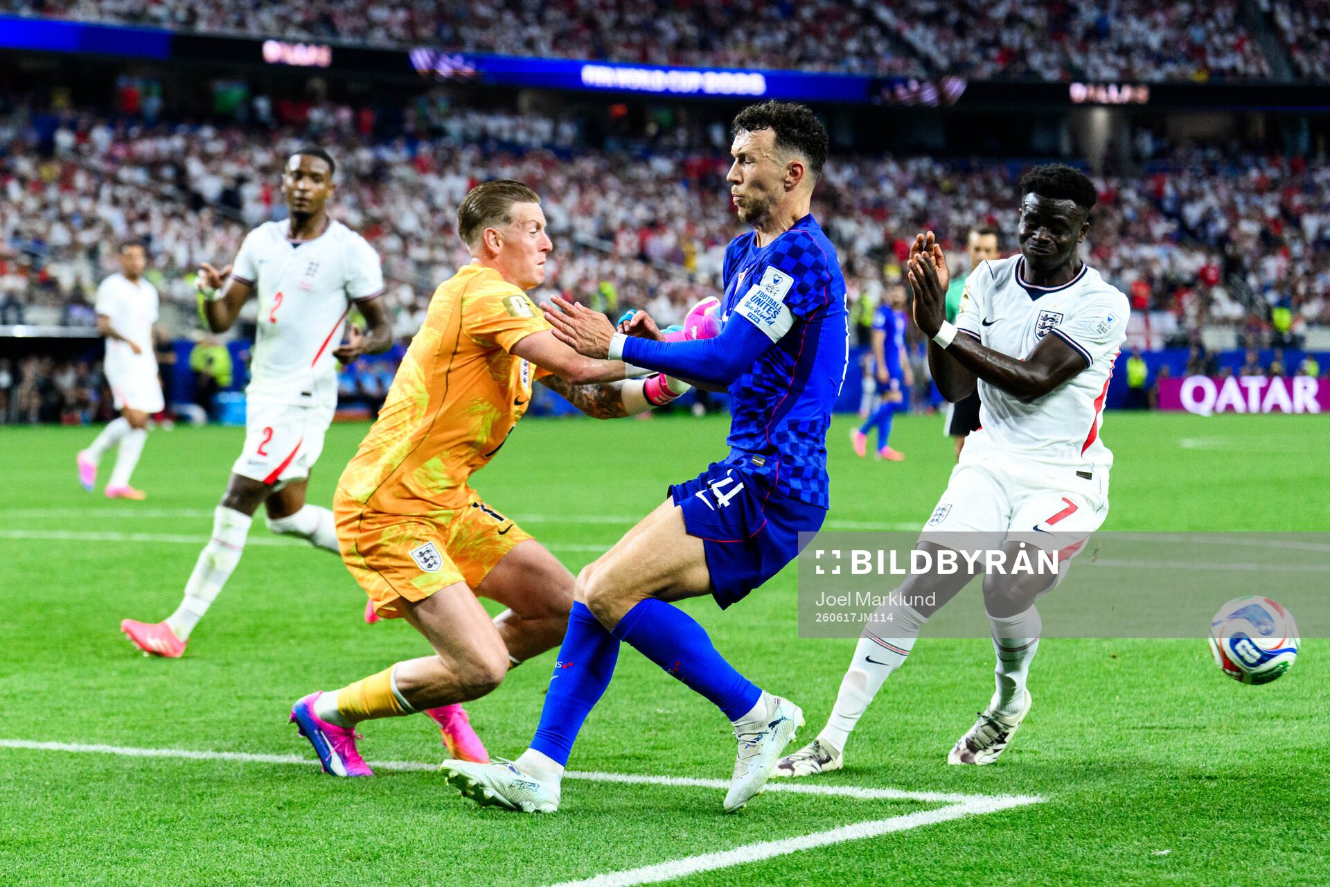 Goalkeeper Jordan Pickford and Bukayo Saka of England and
