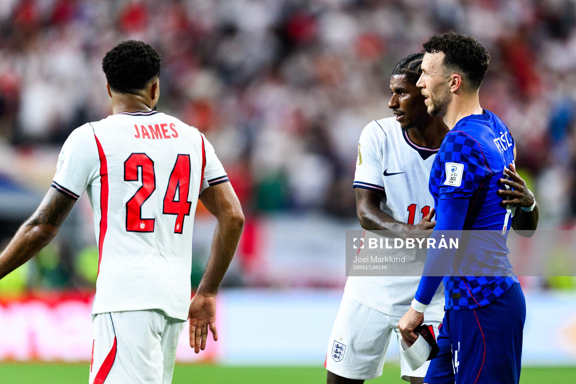 Marcus Rashford of England and Ivan Perisic of Croatia