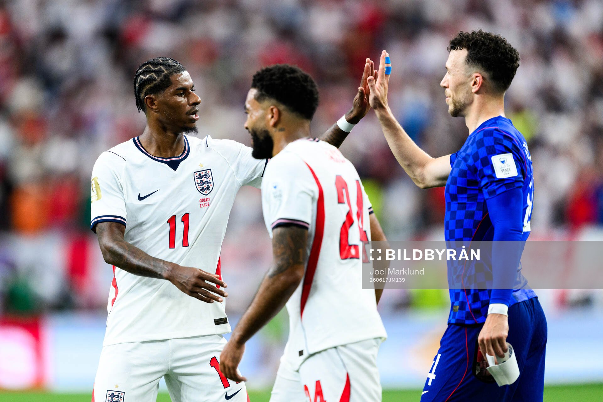 Marcus Rashford of England and Ivan Perisic of Croatia