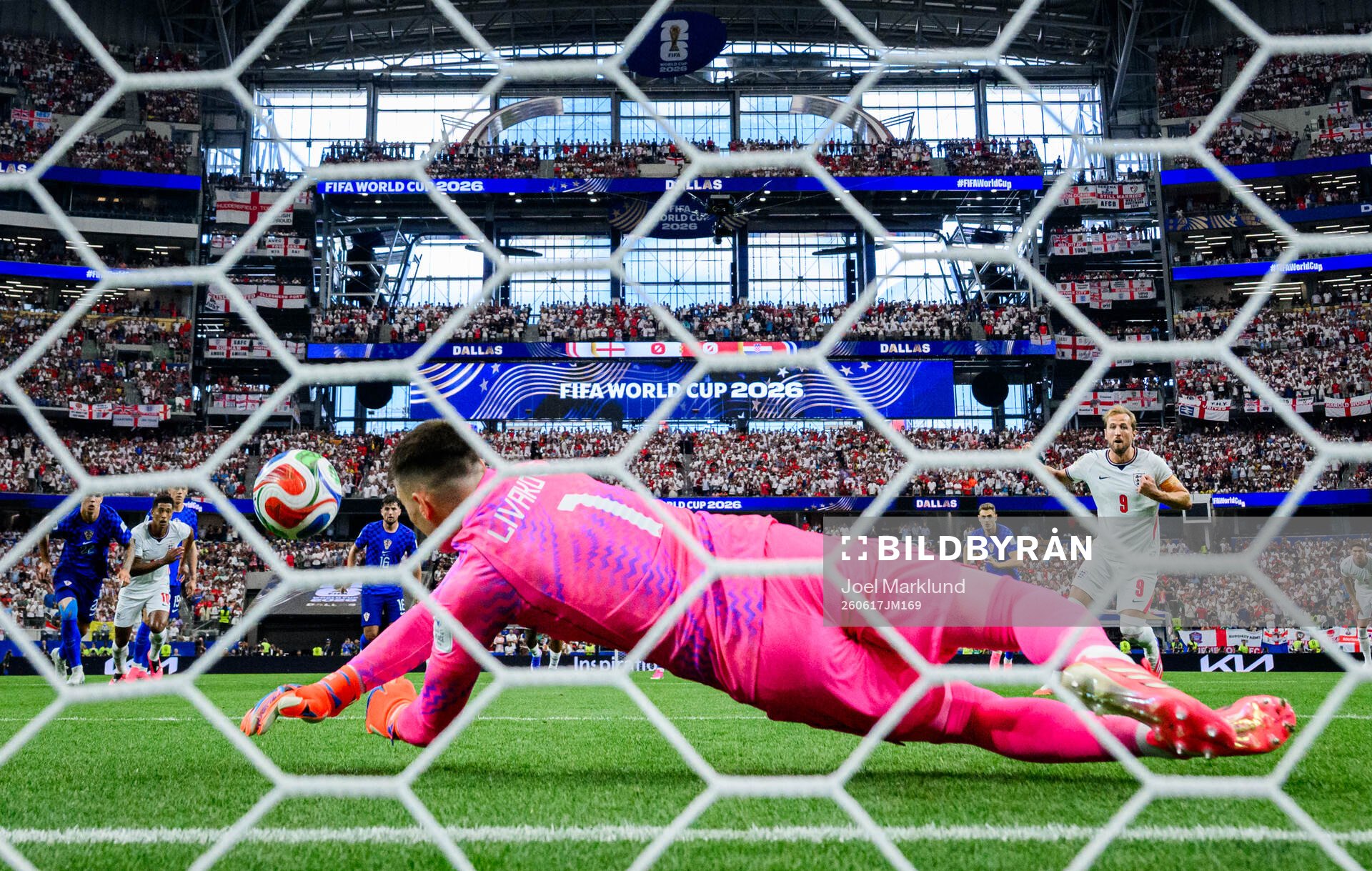 Goalkeeper Dominik Livakovic of Croatia saves a penalty
