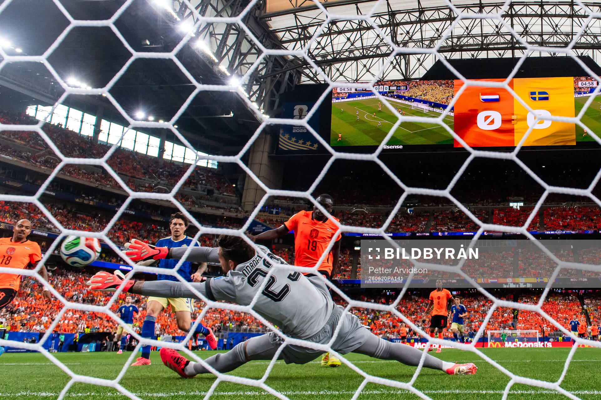 Brian Brobbey of Netherlands scores 1-0 behind goalkeeper