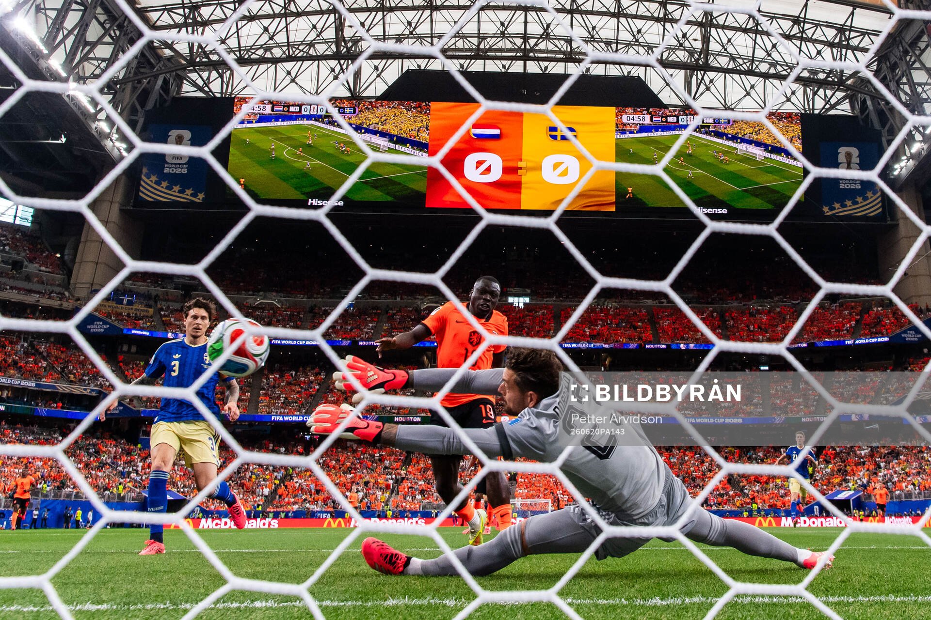 Brian Brobbey of Netherlands scores 1-0 behind goalkeeper