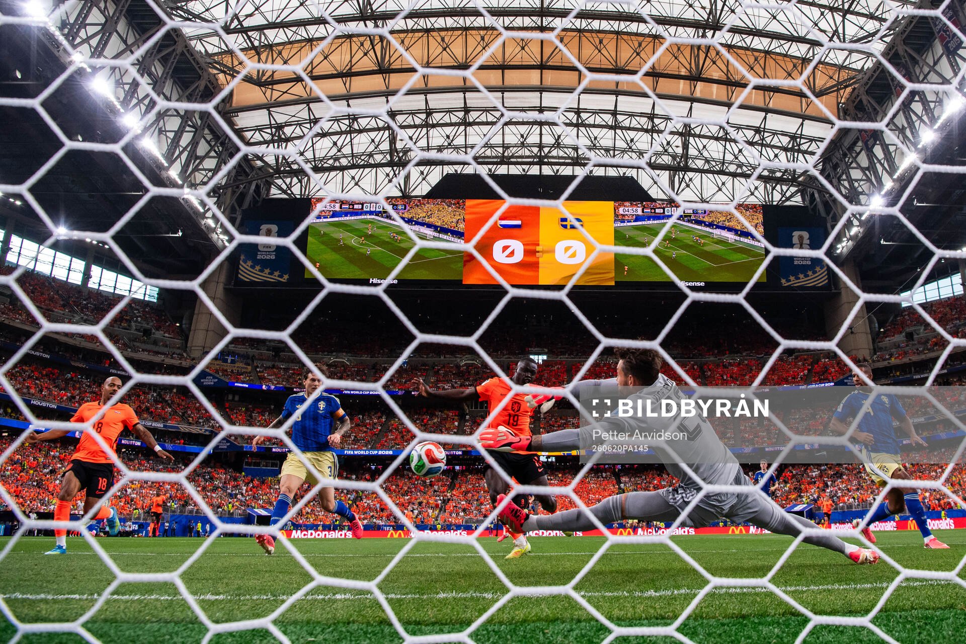 Brian Brobbey of Netherlands scores 1-0 behind goalkeeper