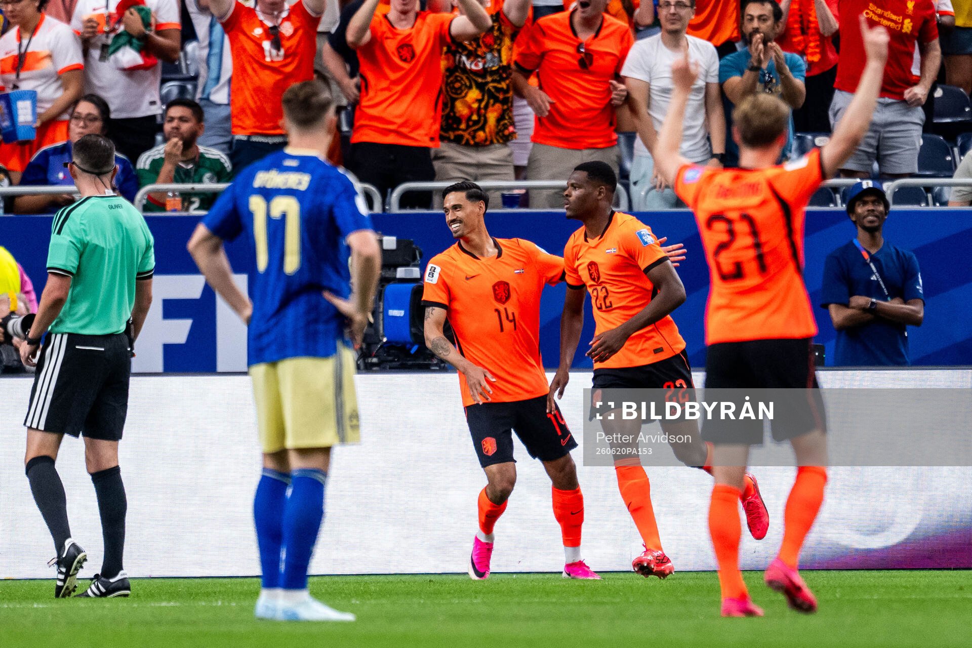 Tijjani Reijnders and Denzel Dumfries of Netherlands