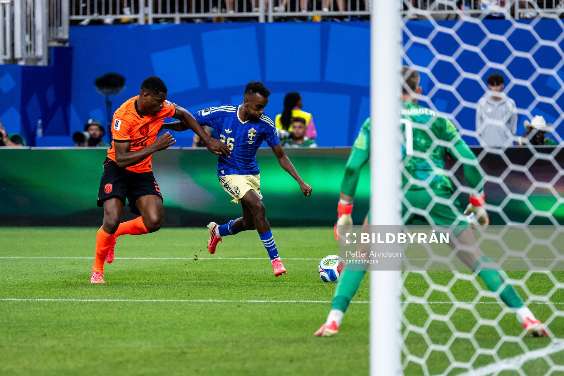 Denzel Dumfries of Netherlands and Taha Ali of Sweden