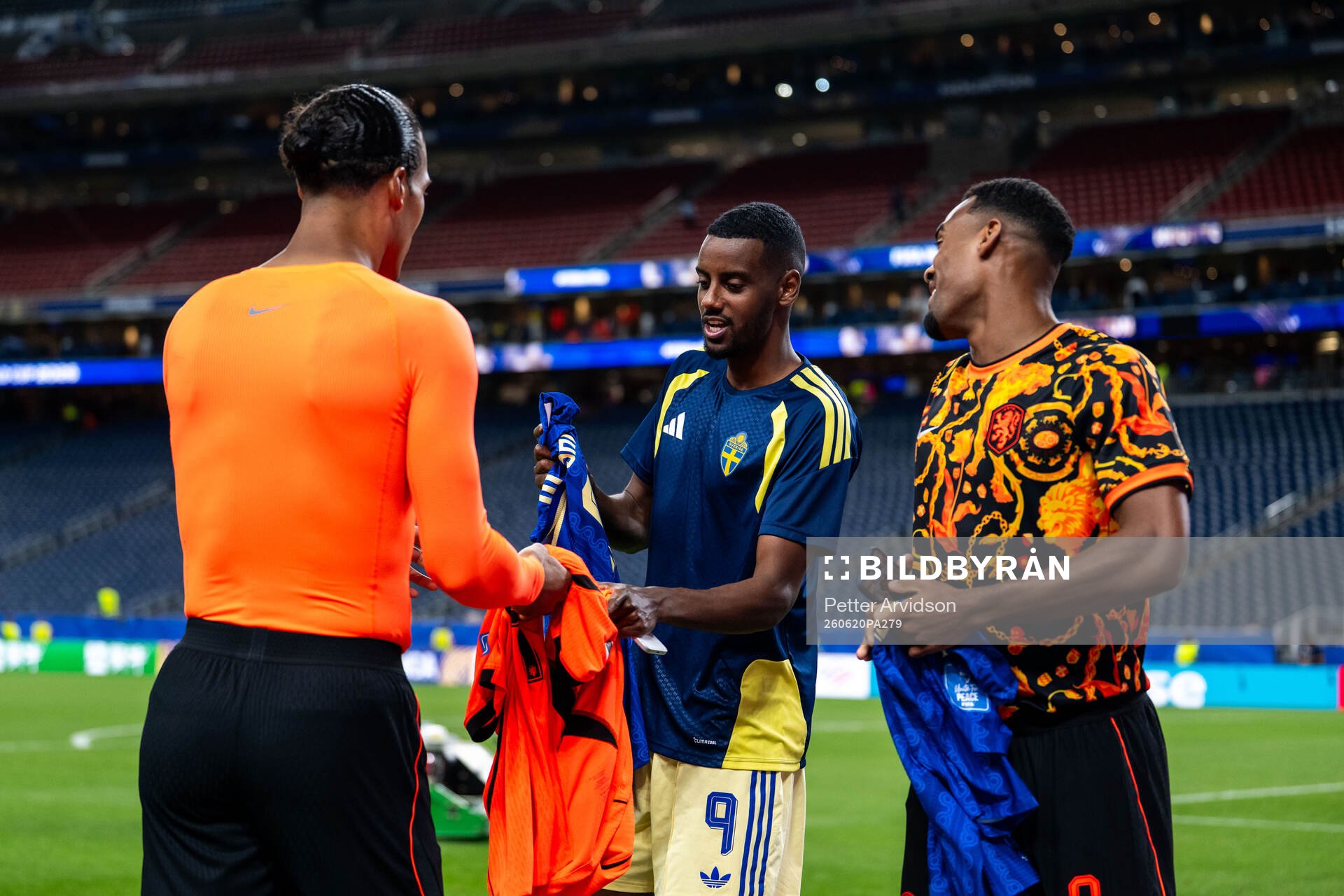 Alexander Isak of Sweden with Virgil Van Dijk and Ryan