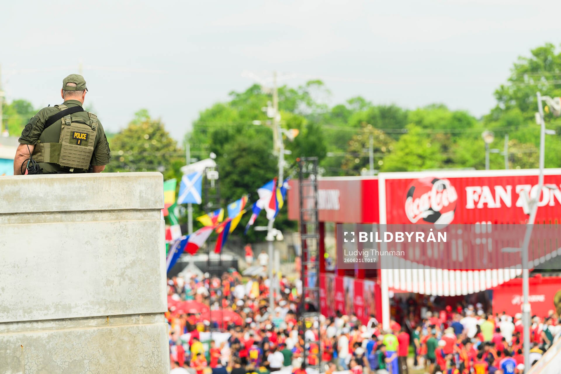 A police officer looks over the fan zone outside of Atlanta